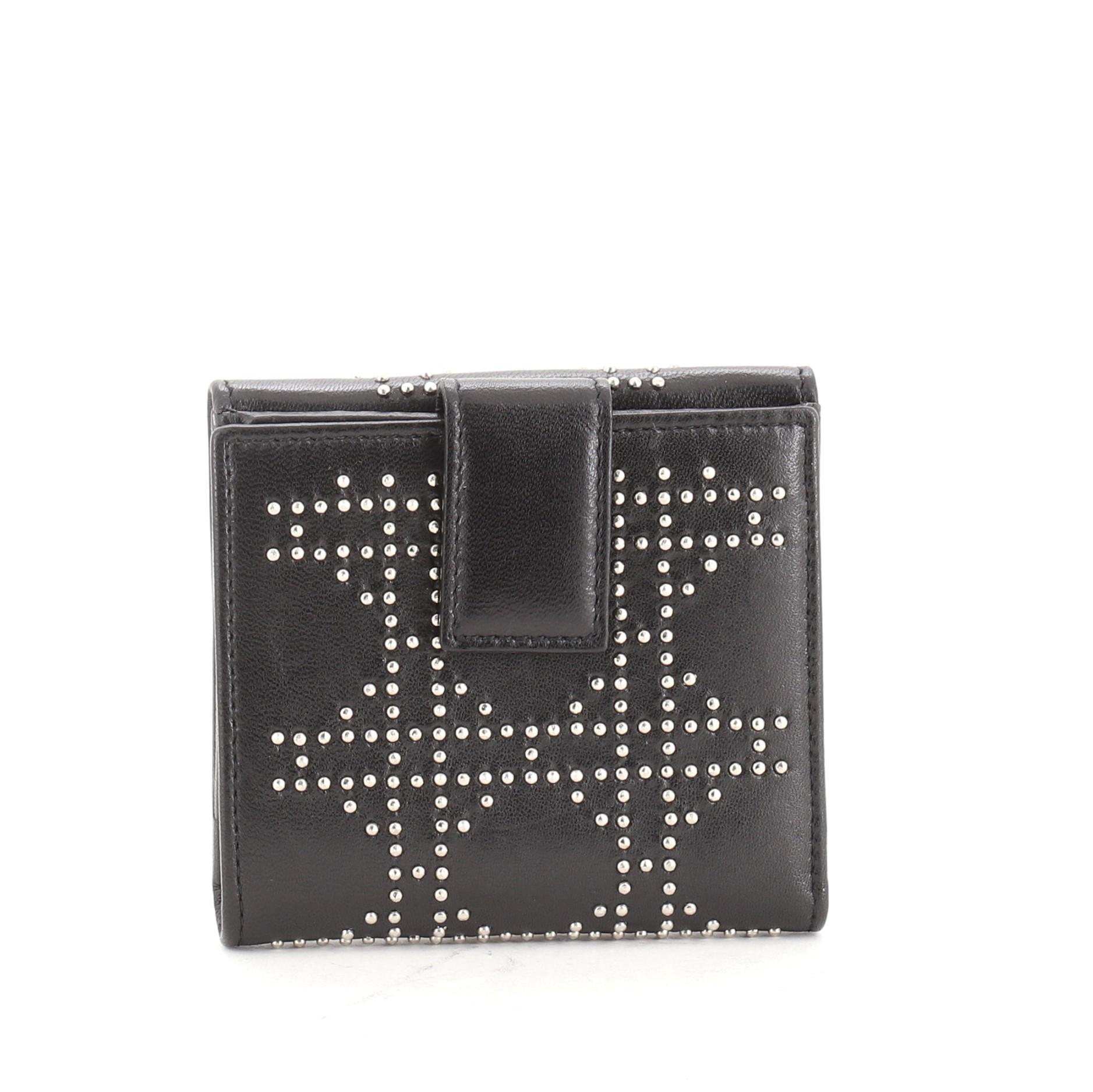 Christian Dior Bifold Wallet Cannage Studded Lambskin
Black Lambskin Stud

Condition Details: Scuffs and indentations on exterior, scratches on hardware.

45410MSC

Height 4