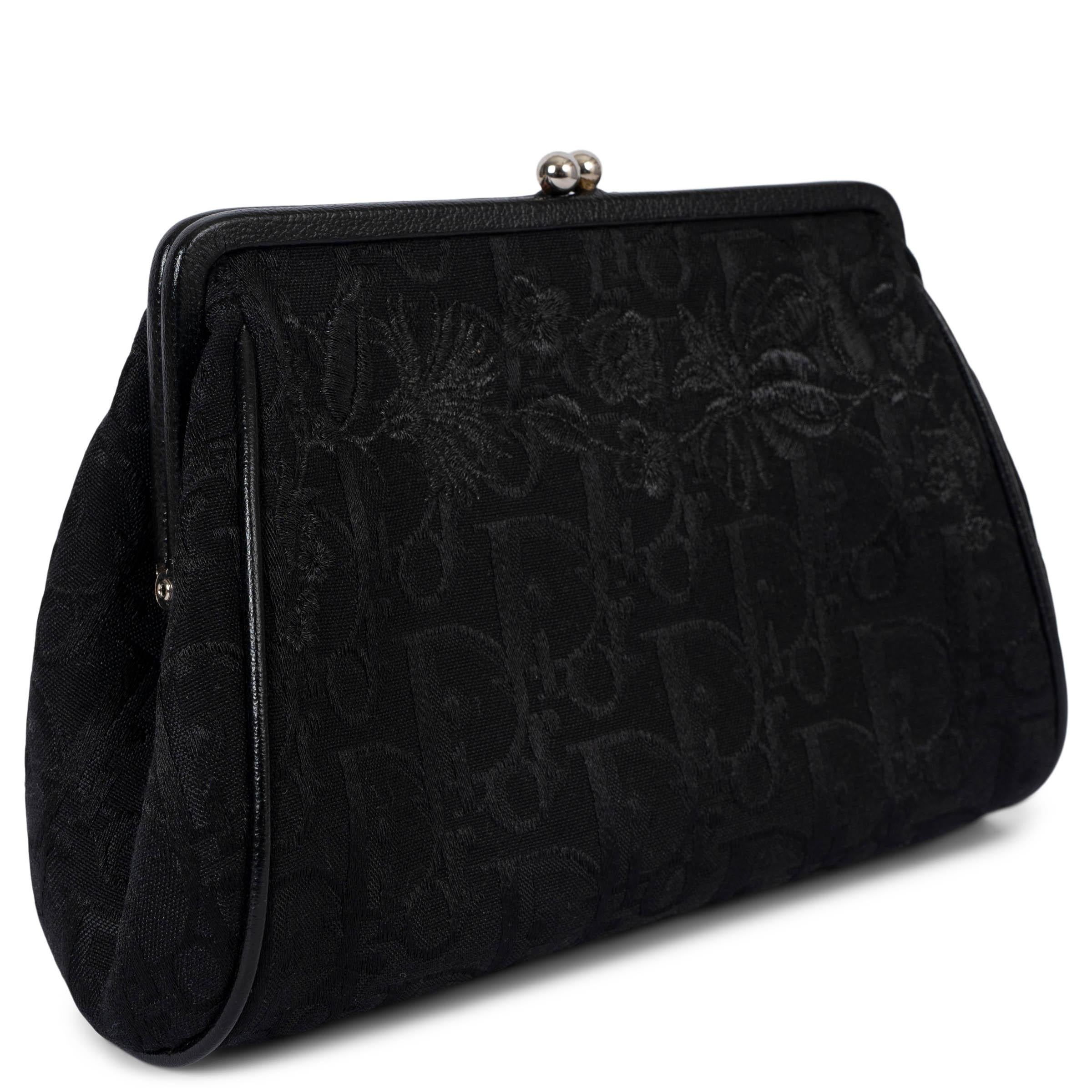 100% authentic Christian Dior frame clutch in black Oblique canvas. Features tonal floral embroidery, black leather trims and silver-tone hardware. Closes with a kisslock on top and is lined in black canvas with an open pocket against the back. Has