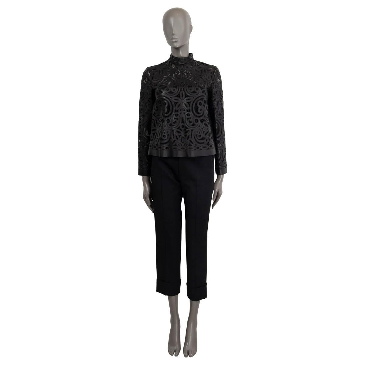 100% authentic Christian Dior laser-cut lace shirt in black lambskin leather (100%). Features a mock neck and a cropped cut. Closed with buttons on the back. Comes with a slip dress in black silk (100%). Has been worn and is in excellent