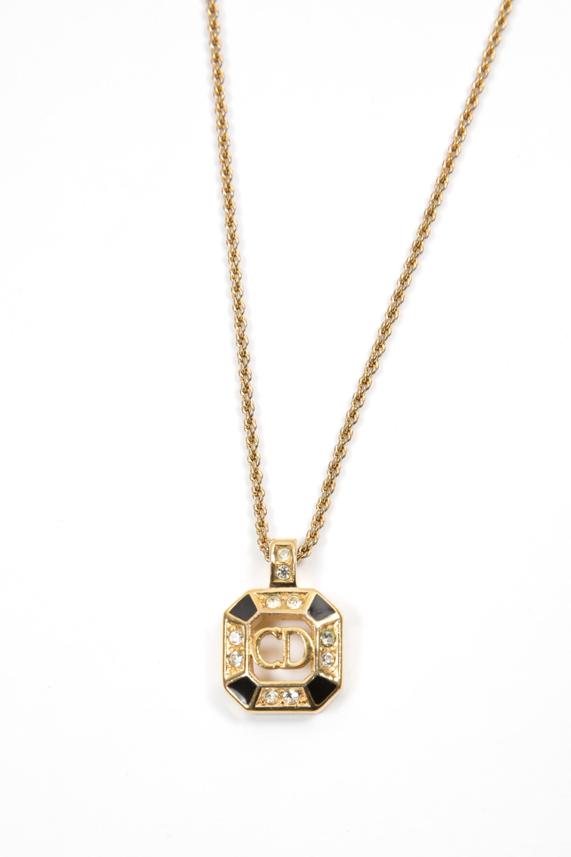 Collana Christian Dior nera e dorata con medaglia centrale 