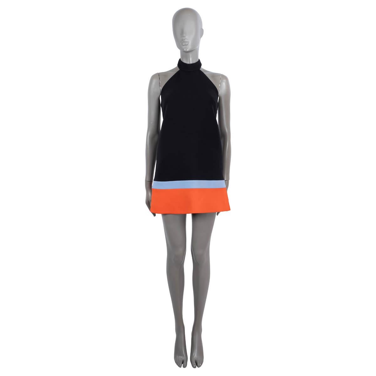 100% authentic Christian Dior colorblock halter mini dress in black, blue and orange polyamide (67%) and viscose (33%). Features a split hem. Closes with a concealed zipper in the back. Lined in silk (100%). Has been worn and is in excellent