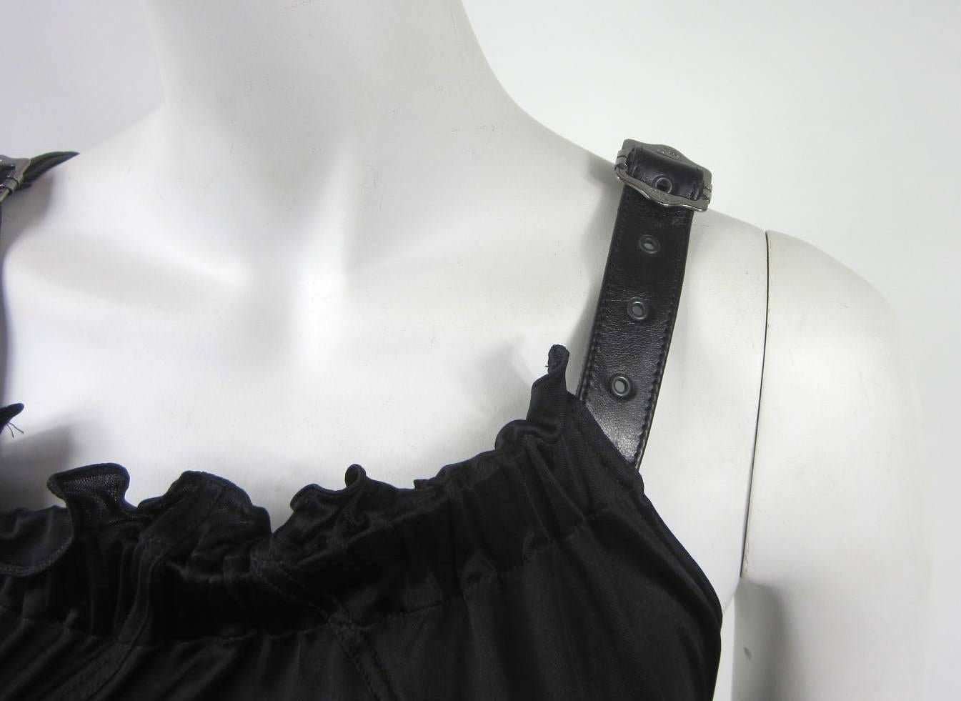 Dior with Black Leather straps and Silver Tone Buckles. Ruffled front with a bondage style back. Measures Chest up to 34 in Waist up to 36 in. Will fit a 8 nicely.  Be sure to check our store front for more fabulous pieces from our collection. We