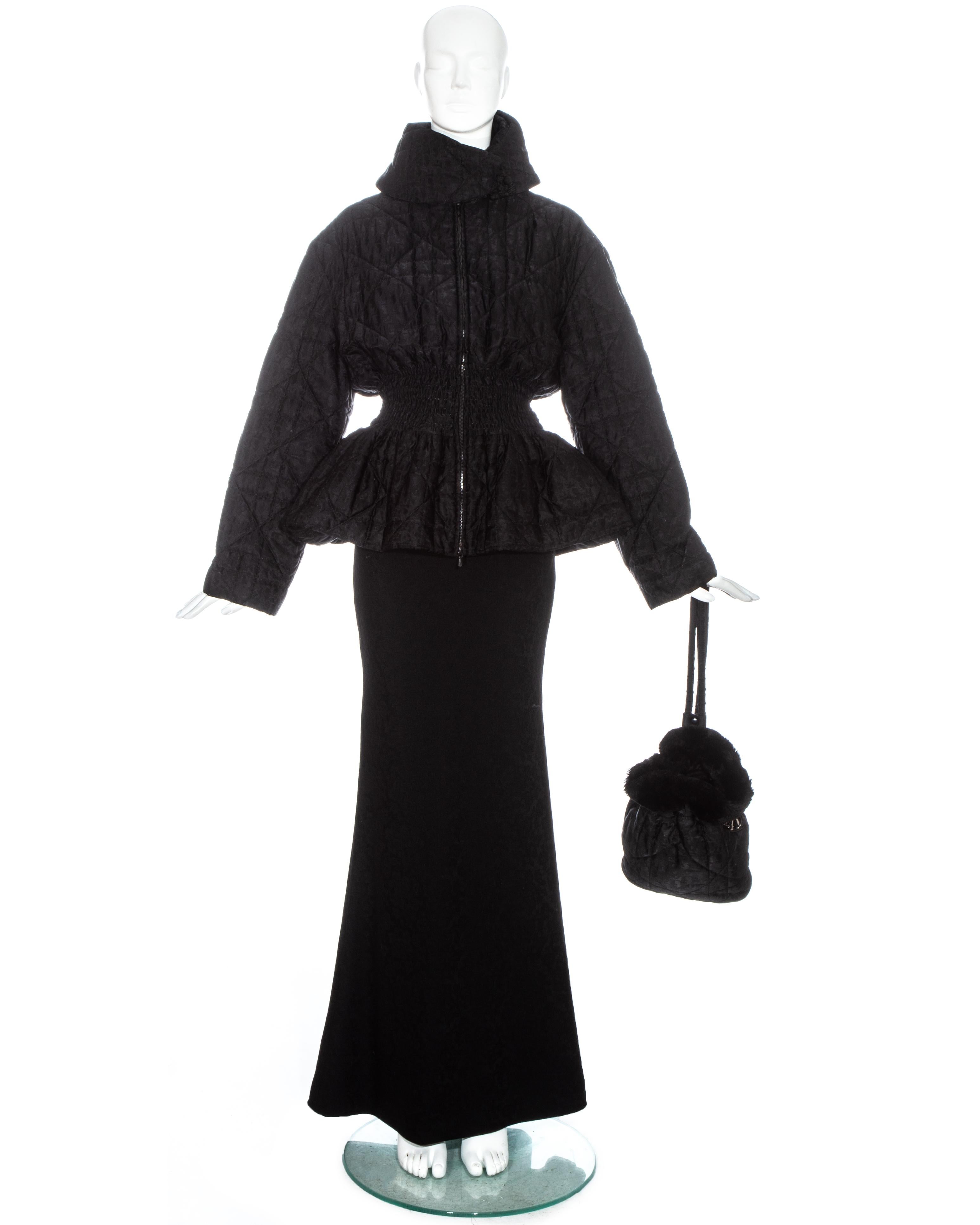 Christian Dior by John Galliano black 3 piece runway ensemble comprising: monogram Cannage quilted nylon jacket with shirred waistband, matching mini backpack with fur trim and wool jacquard fishtail maxi skirt. 

Fall-Winter 1998