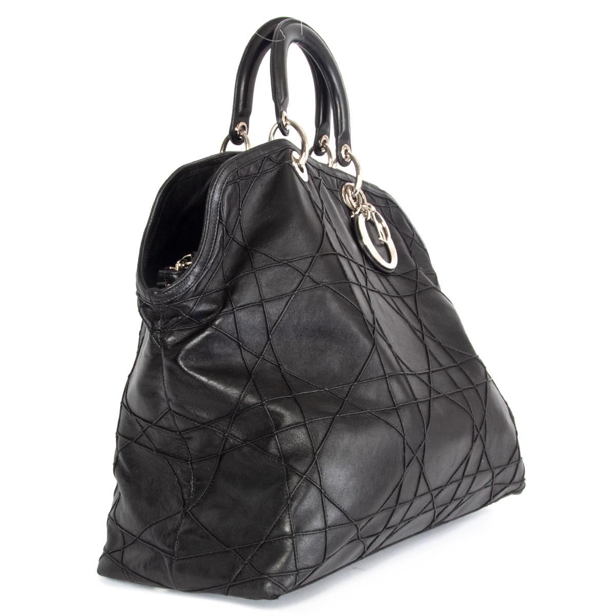 100% authentic Christian Dior Granville tote shoulder bag in black cannage quilted lambskin featuring silver-tone hardware. Divided in three compartments with one big zipper pocket in the middle with a black nylon and lambskin lining. Small zipper