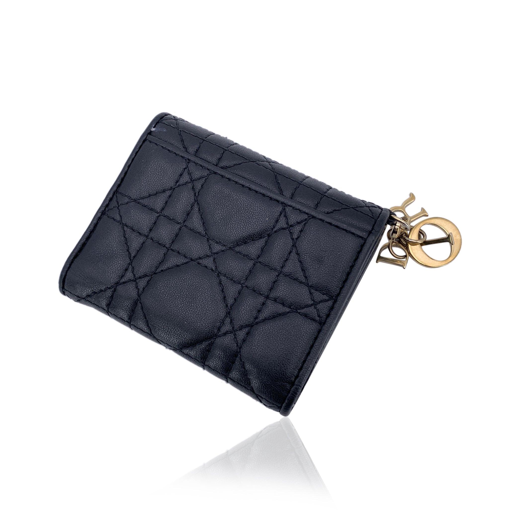 This beautiful Bag will come with a Certificate of Authenticity provided by Entrupy. The certificate will be provided at no further cost Step into the world of timeless luxury with this Christian Dior compact flap wallet, a sophisticated piece