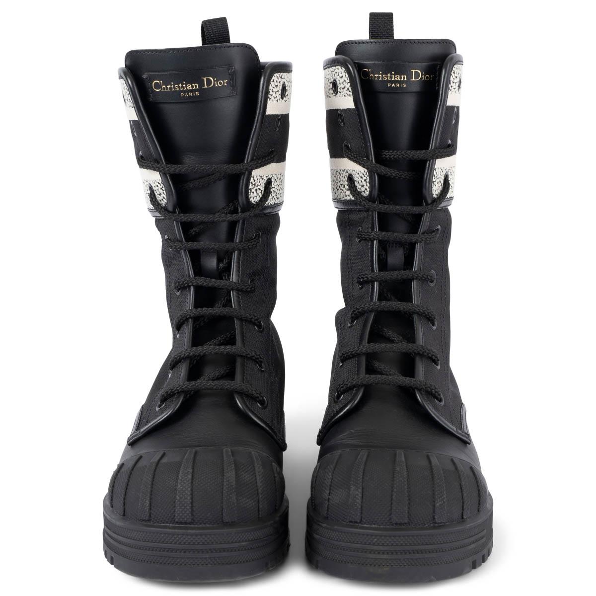 100% authentic Christian Dior D-Major laced-up ankle-boots in black technical fabric and calfskin. Embellished with a white Christian Dior embroidered band, inspired by the Dior Book Tote. The heel, round toe and thick notched rubber sole complete