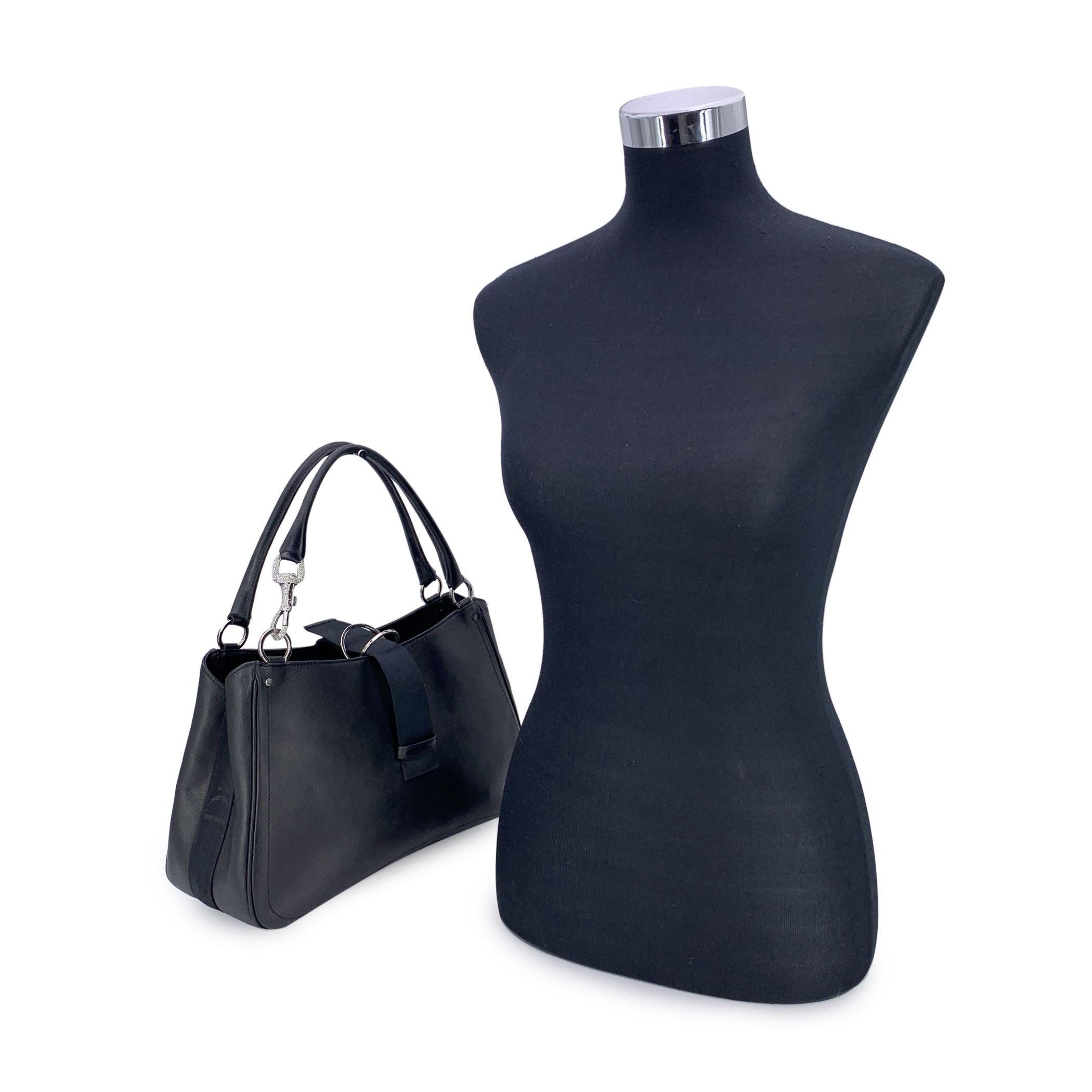 This beautiful Bag will come with a Certificate of Authenticity provided by Entrupy. The certificate will be provided at no further cost. Step into timeless luxury with this authentic CHRISTIAN DIOR black canvas Crystal Hardcore Shoulder Bag.