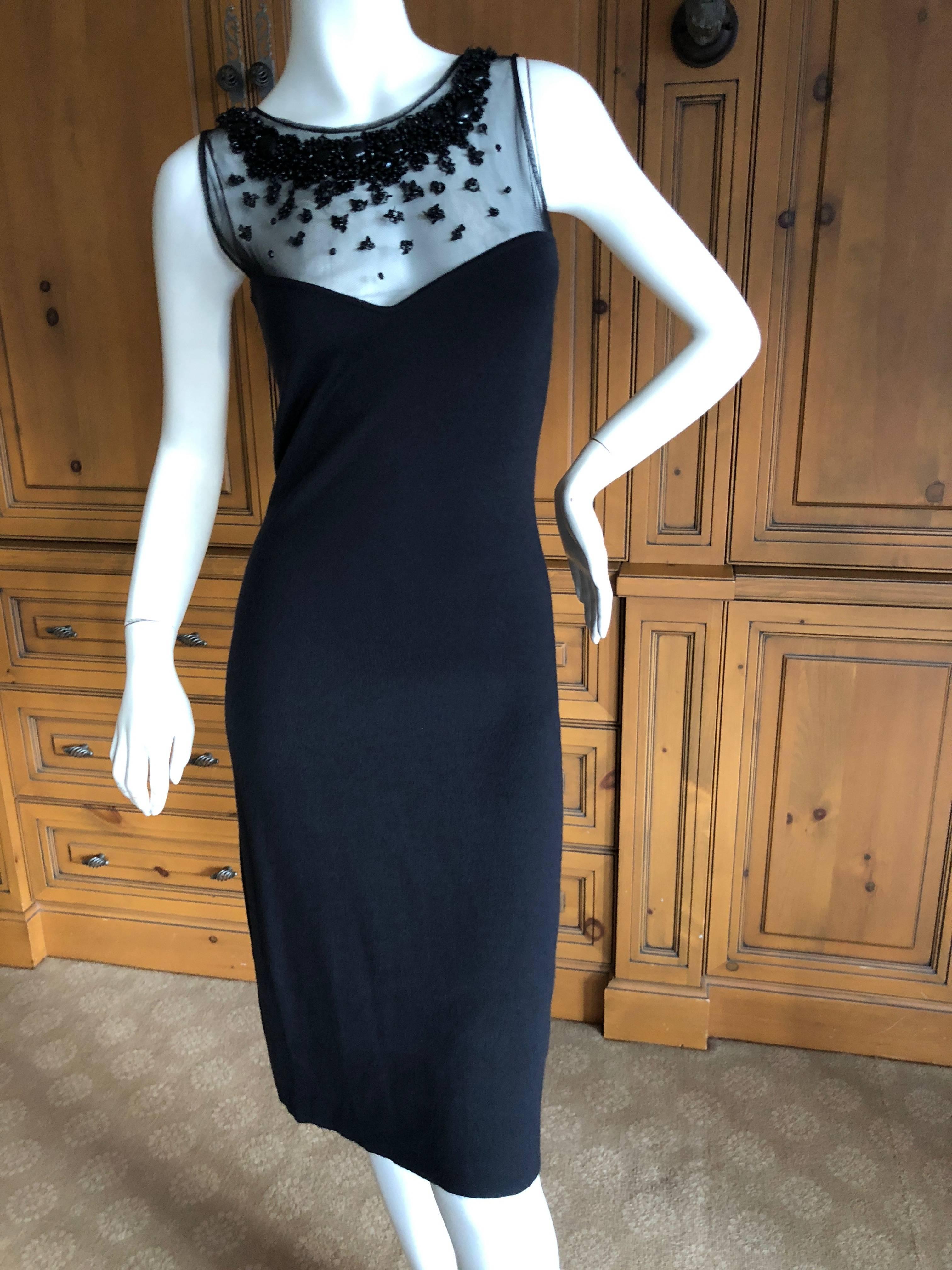 Simply amazing cashmere shift dress with jewels sewn on to a net overlay by Lesage.
 This is so much prettier in person, it really sparkles a lot.
I believe this is by John Galliano for Dior, but it could be Ferre. 

There is a lot of stretch, no