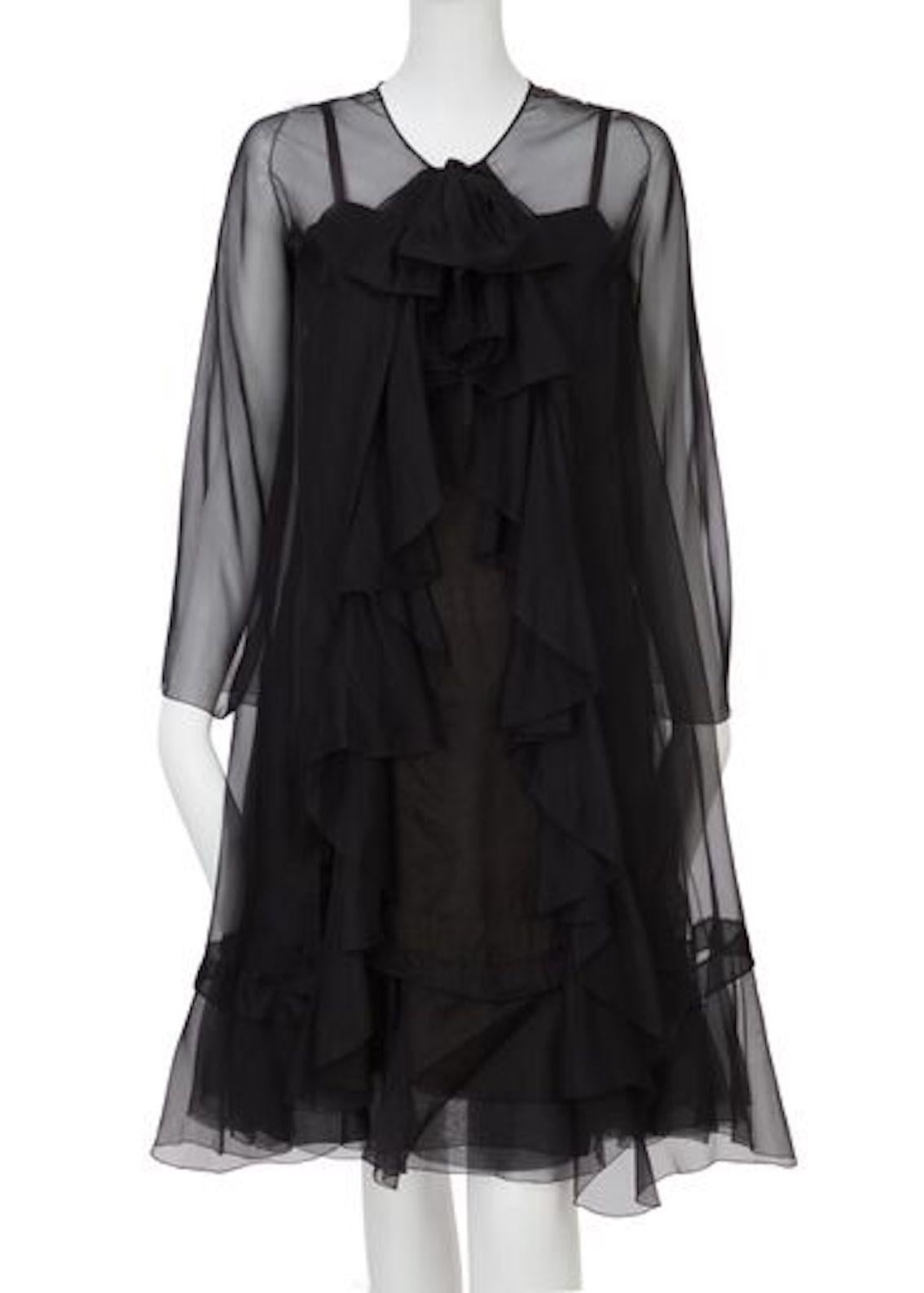 Haute Couture Spring/Summer 1966, black silk chiffon dress with spaghetti straps and long sleeved jacket with ruffle detail to the front.


