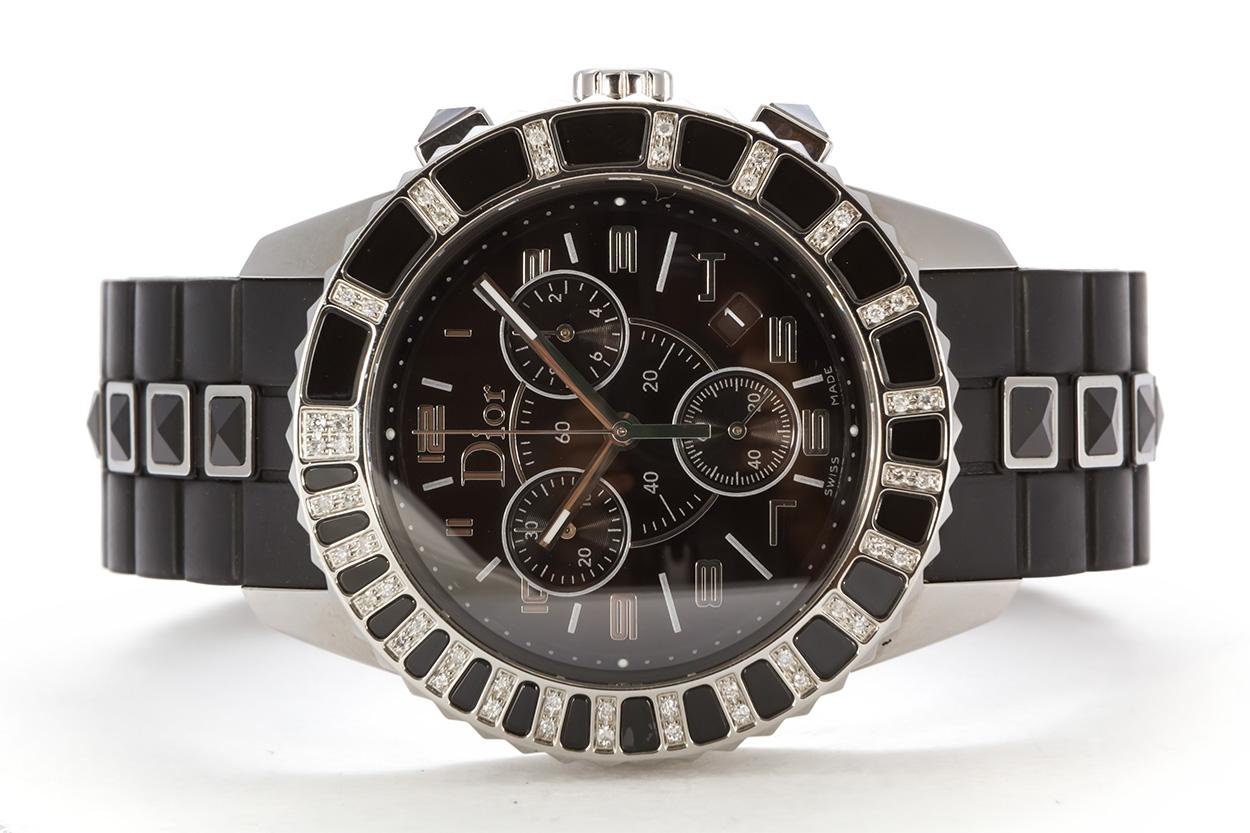 We are pleased to offer this Christian Dior Black Christal Chronograph Quartz Watch CD114317R001. This watch features a chronograph quartz movement, sapphire crystal, black dial and rubber strap, white diamonds and black sapphire crystals set in a