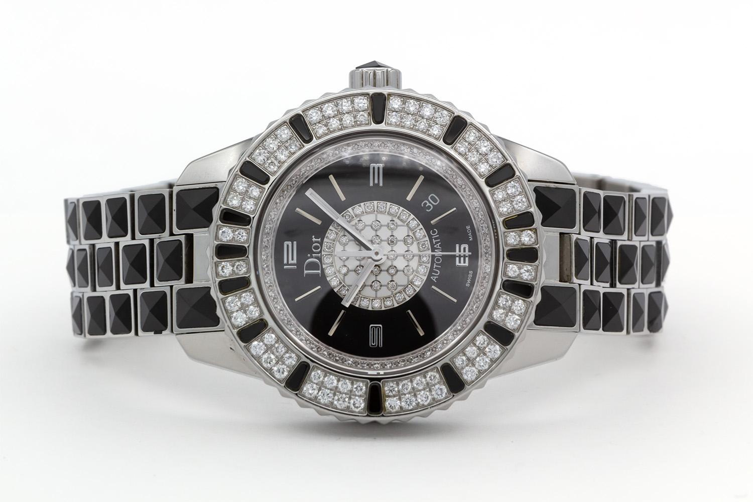 We are pleased to offer this Christian Dior Black Christal Diamond Automatic Watch CD113511. This watch features a 33mm stainless steel case, automatic movement with exhibition case back, stainless steel & diamond bezel, black dial with diamond