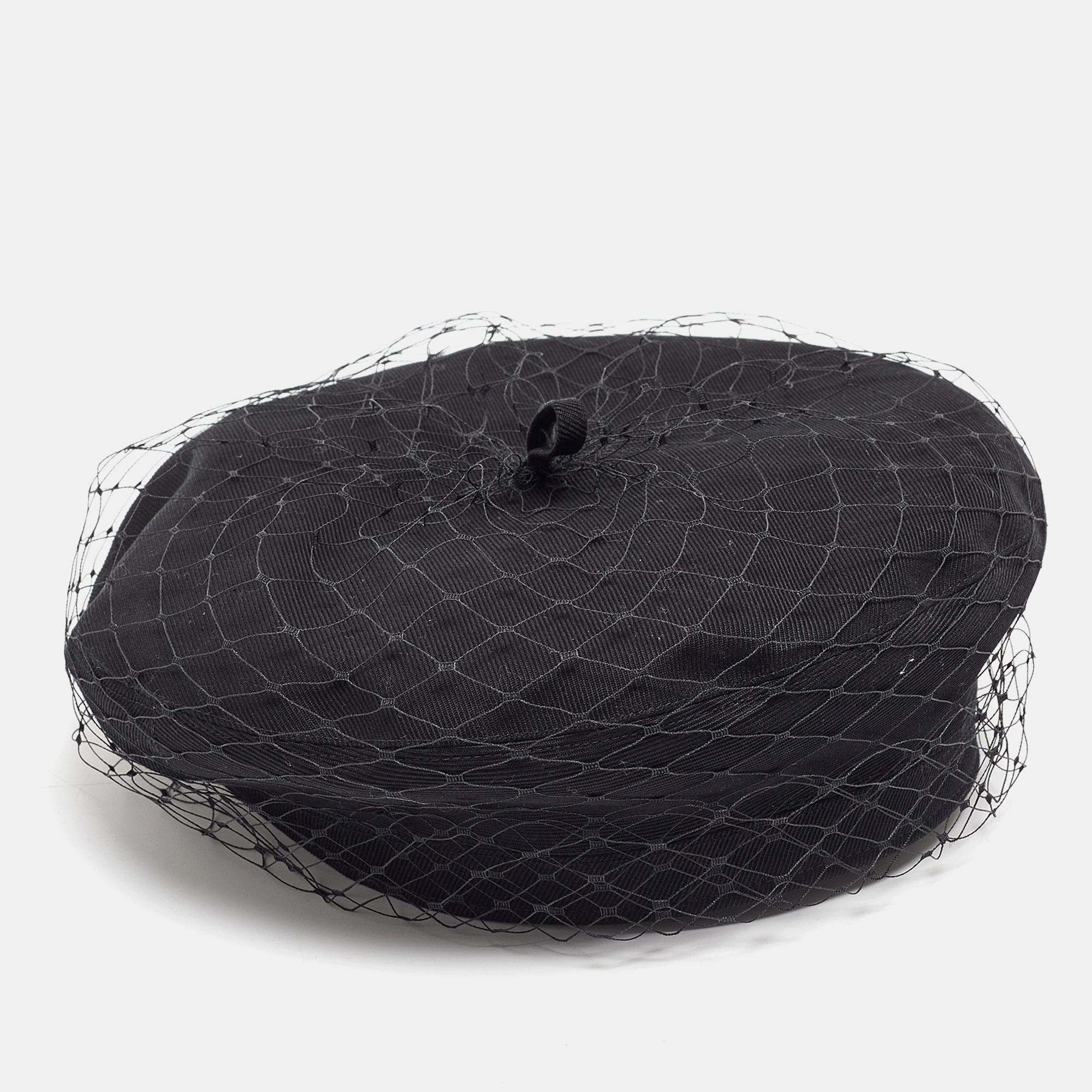 Imbued with the timeless essence of Christian Dior, this beret melds the softness of black cotton with the allure of delicate mesh. Its design, both refined and understated, evokes a sense of effortless chic, making it a versatile accessory for any
