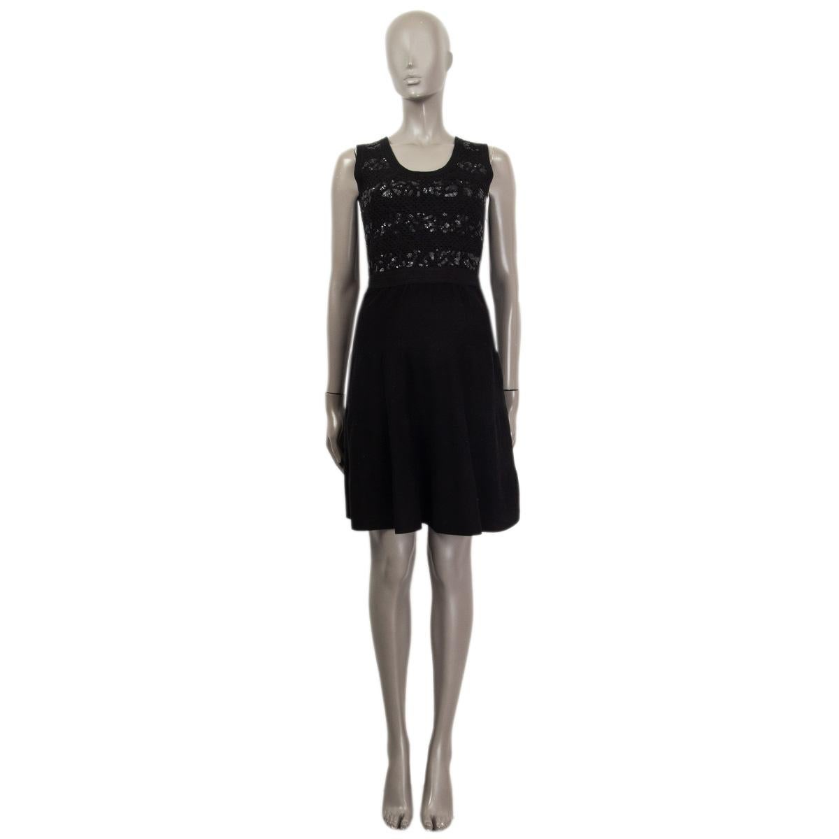 100% authentic Christian Dior sleeveless knee-length knit dress in black cotton (100%). With sequin embellishments at top and a scoop neck. Opens with a concealed zipper on the side. Lined in silk. Has been worn and is in excellent