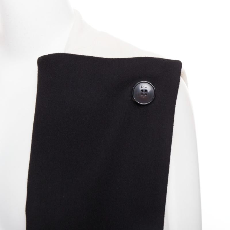 CHRISTIAN DIOR black cream double cashmere bicolor silk lined coat vest FR36 S
Reference: NKLL/A00577
Brand: Dior
Designer: Maria Grazia Chiuri
Material: Cashmere
Color: Black, Cream
Pattern: Solid
Closure: Button
Lining: Black Silk
Extra Details: