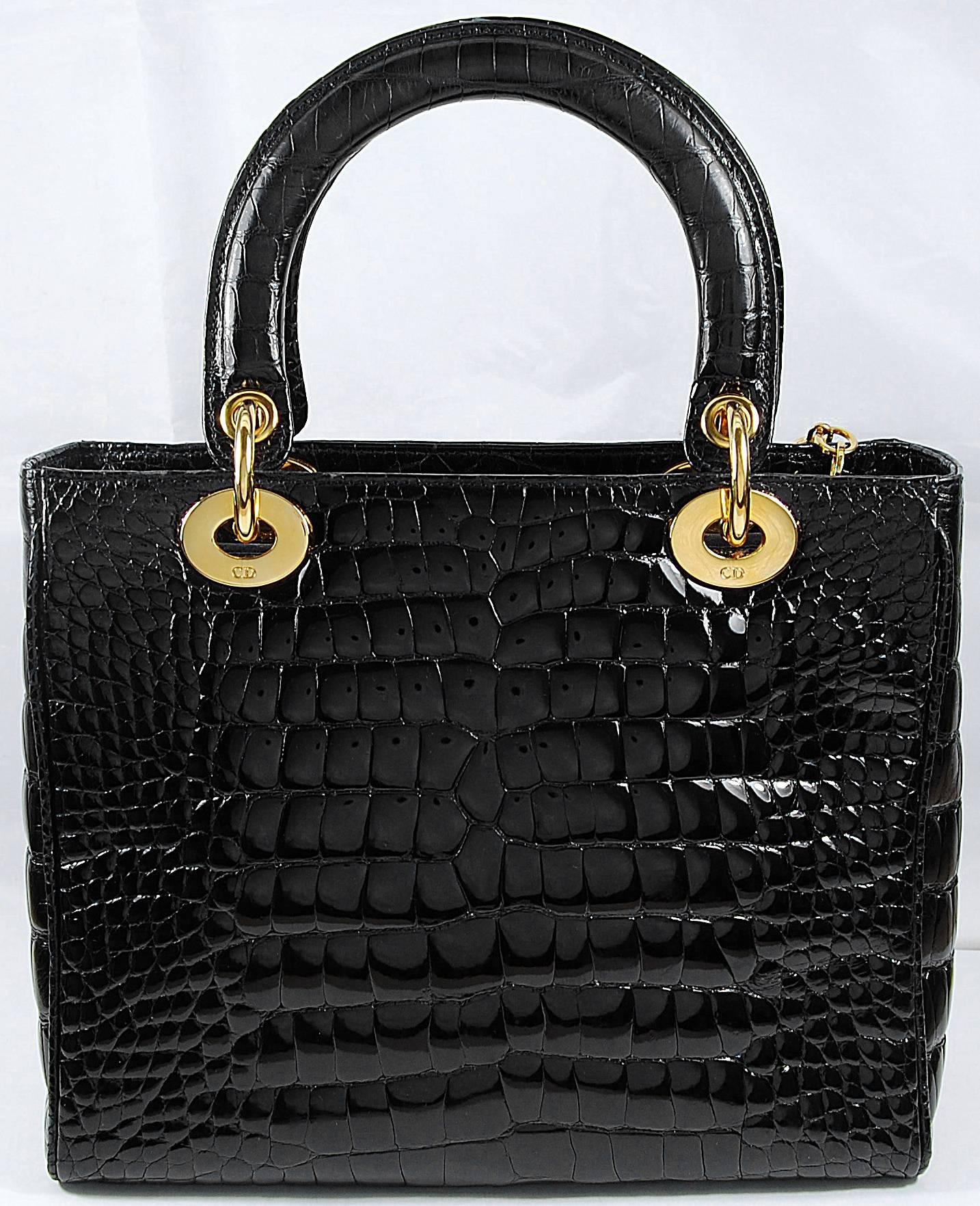 Christian Dior Black Crocodile Lady Bag with Gold Hardware
100% Authentic Christian Dior Bag
COLOR: Black
MATERIAL: Crocodile
HARDWARE: Gold
ORIGIN: France
CONDITION: Pristine
INCLUDES: Dustbag, Shoulder Strap