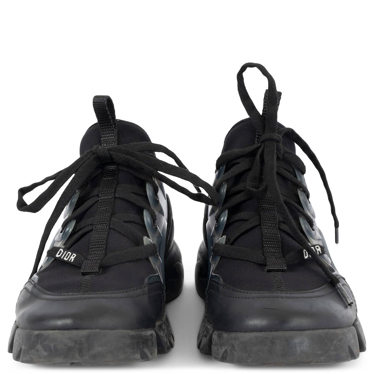 100% authentic Christian Dior D-Connnect sneakers in black stretchy technical fabric. Features a thick rubber sole, transparent rubber inserts and nylon tabs on front and back. Have been worn and show some wear to the rubber sole. Overall in very