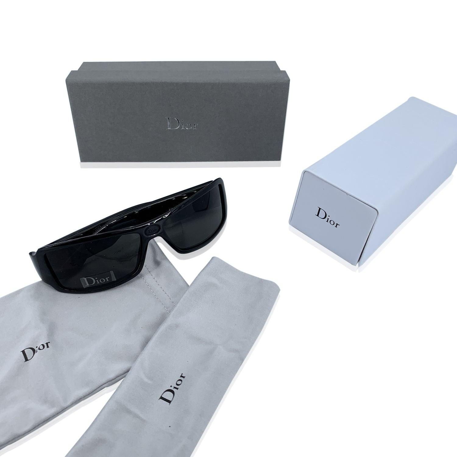Vintage 90s unisex CHRISTIAN DIOR Rubber 2 Sunglasses, XH1. Size 59/14 130mm. Black acetate frame, sides with monogram Oblique rubber panels on ears. 100% Total UVA/UVB protection grey lenses. Made in Italy. Details MATERIAL: Plastic COLOR: Black