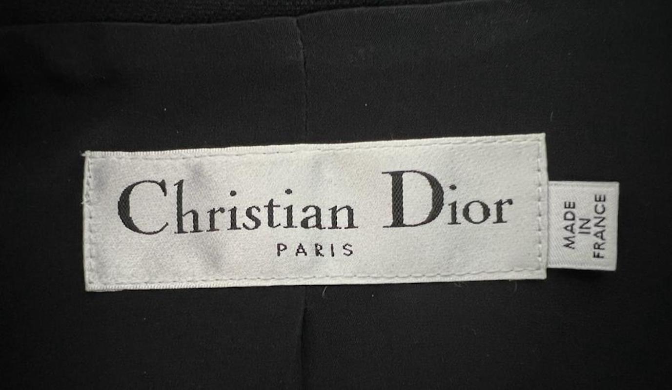 Christian Dior Black Dress

This Christian Dior black dress is a stunning and elegant piece that is perfect for any occasion. Made from high-quality silk, this dress is both stylish and comfortable. The dress has a fitted silhouette and a black