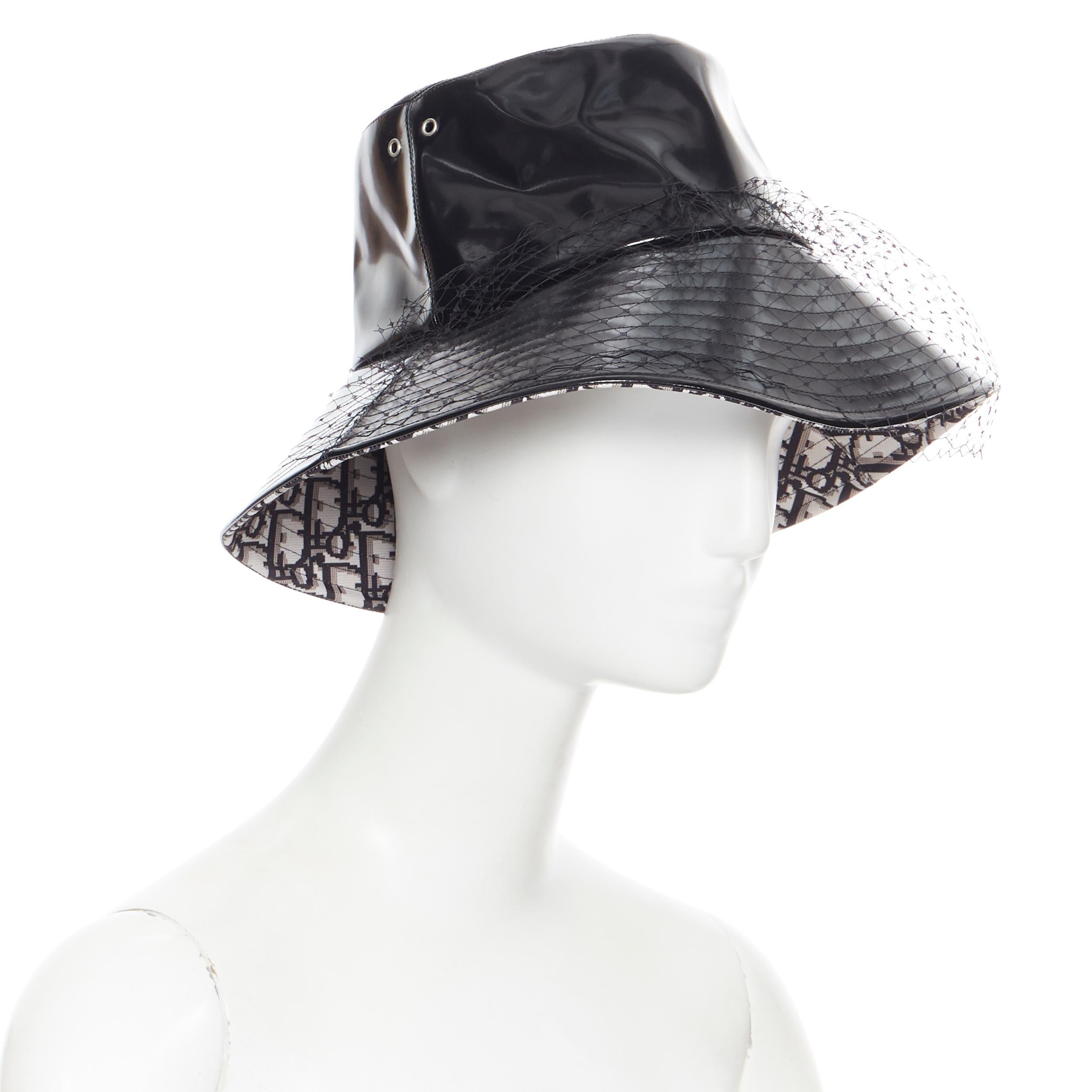 CHRISTIAN DIOR black faux leather net mesh trimmed monogram oblique bucket hat
Brand: Dior
Designer: Maria Grazia Chiuri
Model Name / Style: Bucket hat
Material: Other
Color: Black
Pattern: Solid
Made in: France

CONDITION: 
Condition: Excellent,