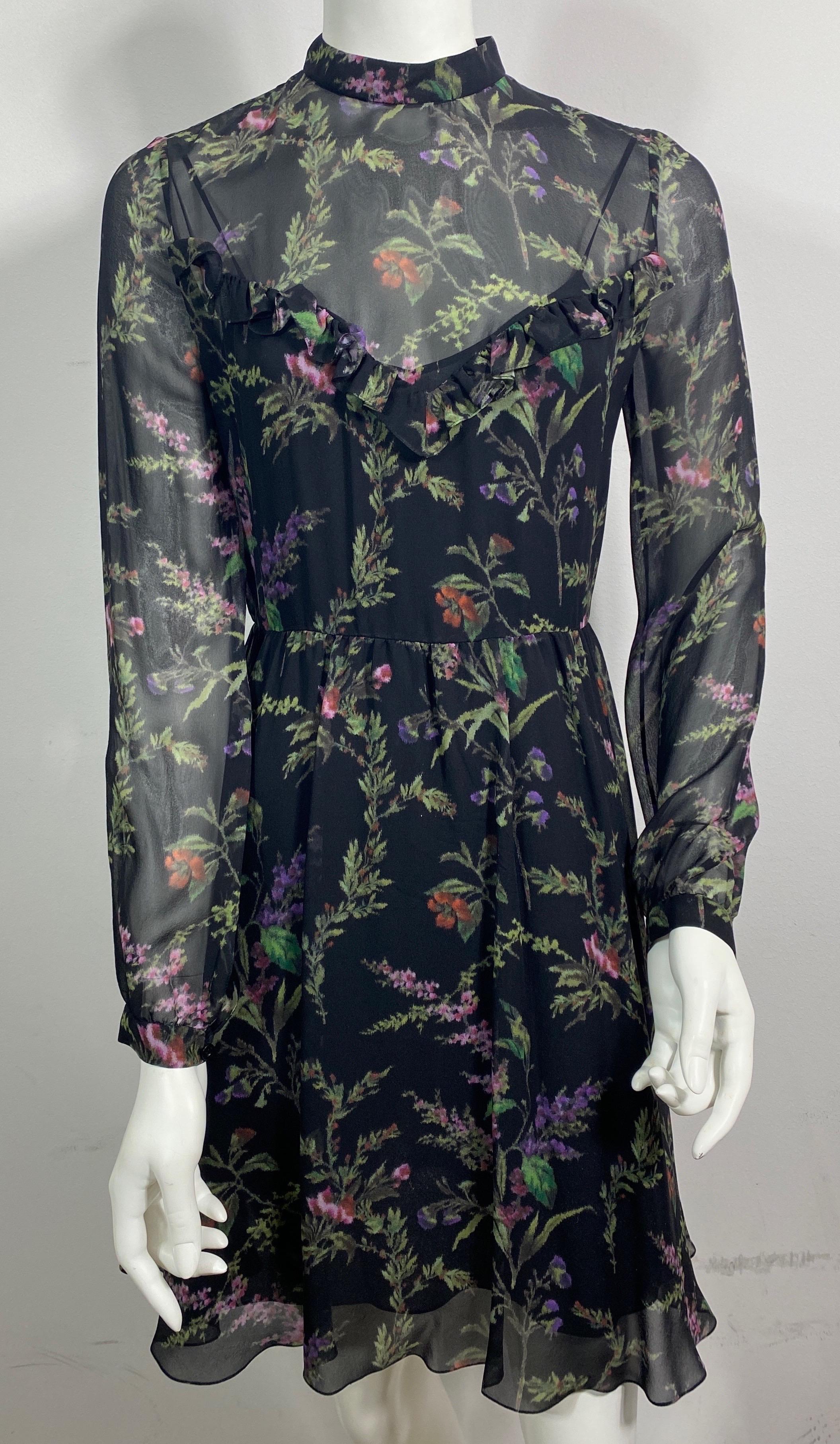 Christian Dior Black Floral Print Silk Chiffon Long Sleeve Dress - Size 36  This transparent silk chiffon floral print dress has a black silk slip with spaghetti straps, some stretch and a 15” side zip. The dress itself has long sleeves with a
