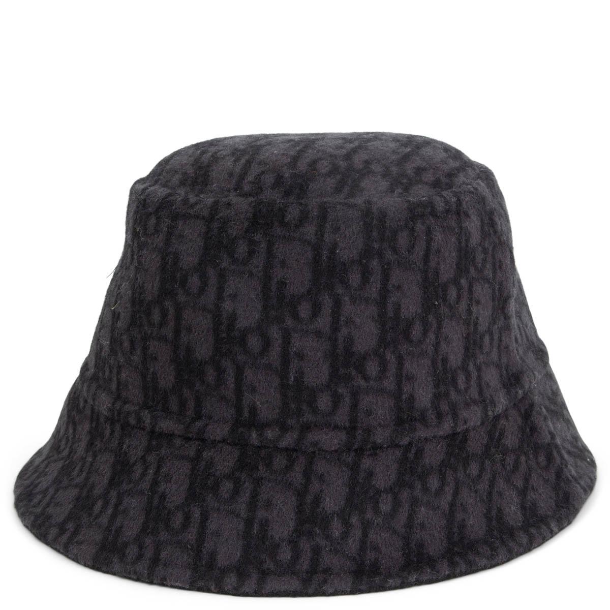 100% authentic Christian Dior Oblique reversible small brim bucket hat in black and dark grey wool (99%) and silk (1%). Has been worn once and is in virtually new condition. Comes with dust bag. 

Measurements
Tag Size	58
Inside Circumference	58cm