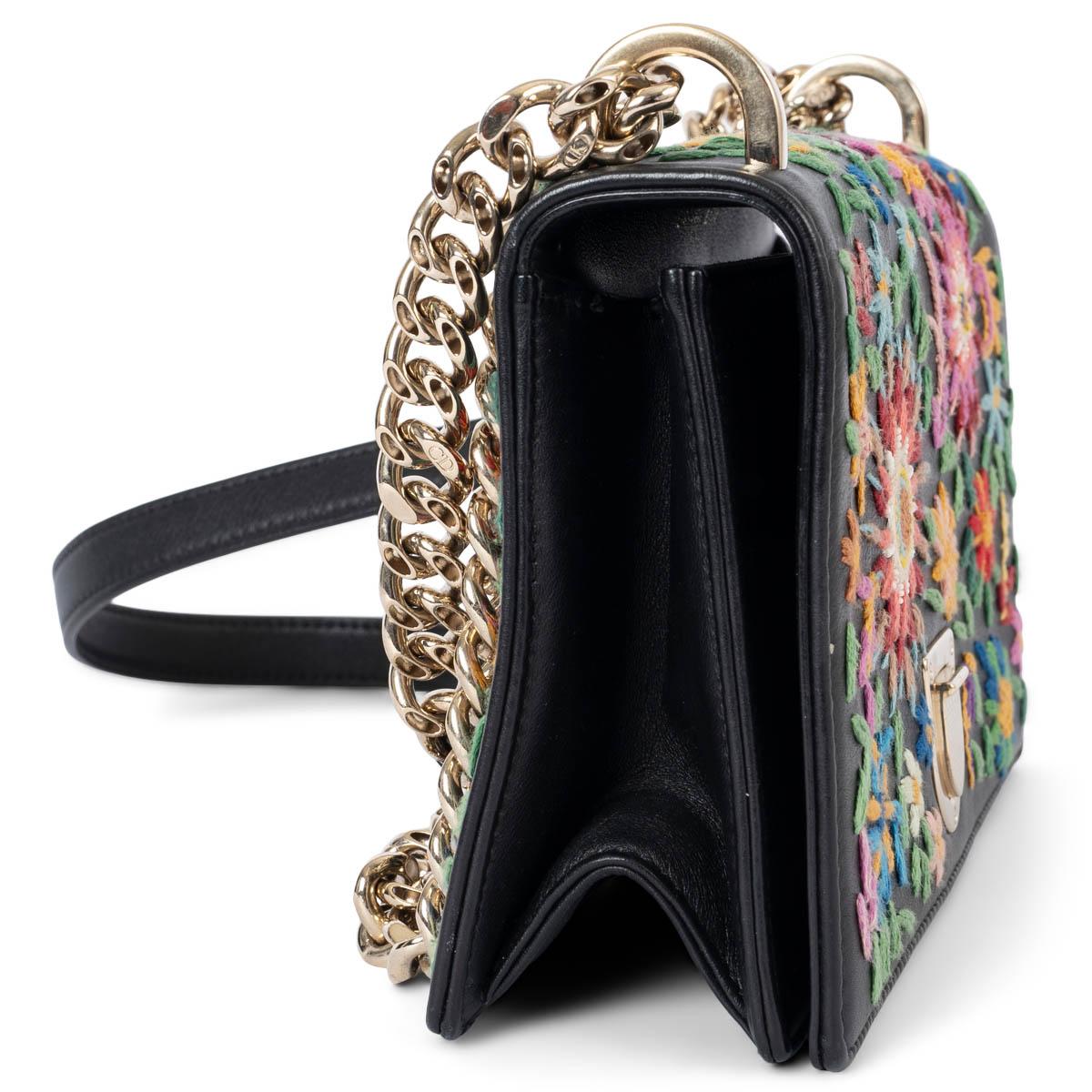 100% authentic Christian Dior Diorama Small flap shoulder bag in leather with mutlicolor floral embroidery. Features a gold-tone hardware and adjustable chain strap. Opens with a push lock on the front and is lined in fabric with an open pocket