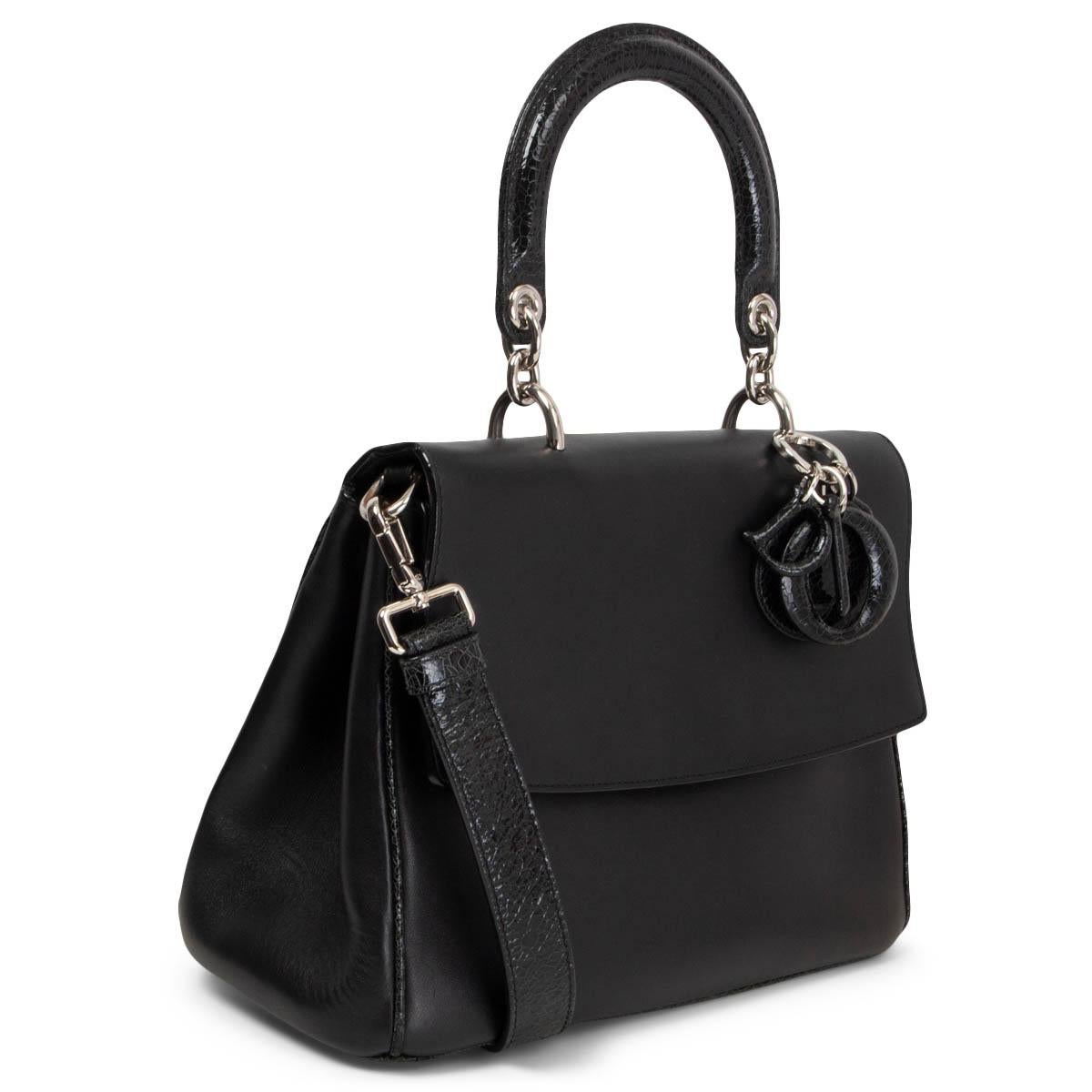 100% authentic Christian Dior Be Dior with in black smooth calfskin featuring silver-tone hardware and crinkled patent leather top handle, back pocket, shoulder-strap and covered metal DIOR charms. Bag comes with a removable long strap an easy-open