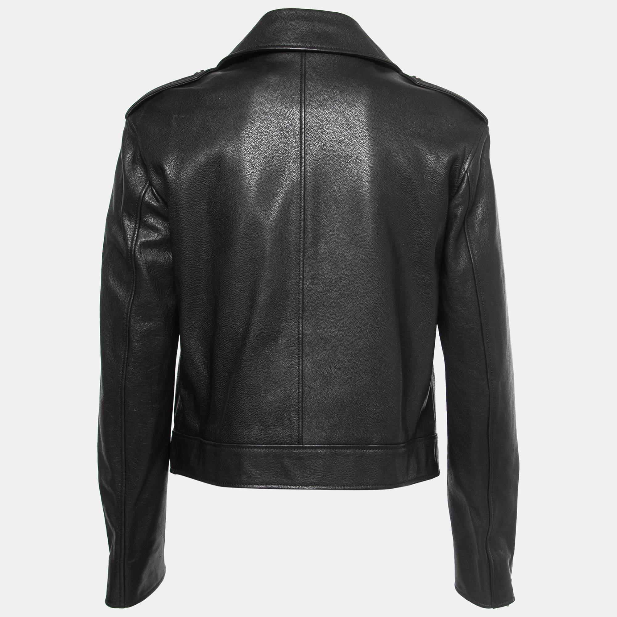 Crafted from high-quality black leather, it features a sleek and fitted silhouette with metal hardware accents and a zippered front. This iconic Christian Dior jacket combines fashion-forward design with a rebellious spirit, making it a must-have