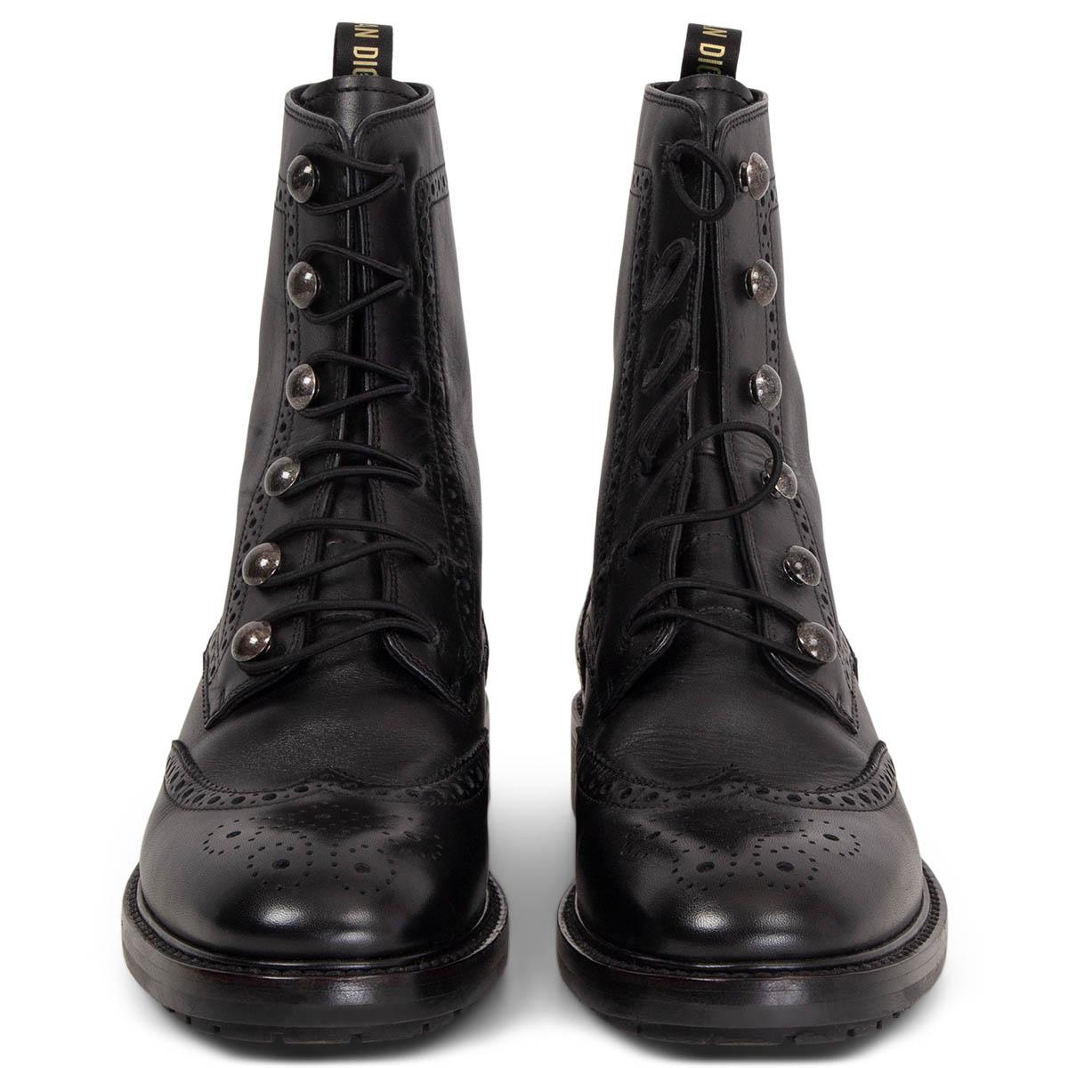 100% authentic Christian Dior Diorunit brogue combat ankle boots in black smooth calfskin with elastic lacing loops and logo pull tab at heel. Black rubber sole with signature white star. Have been worn once or twice and are in excellent condition.