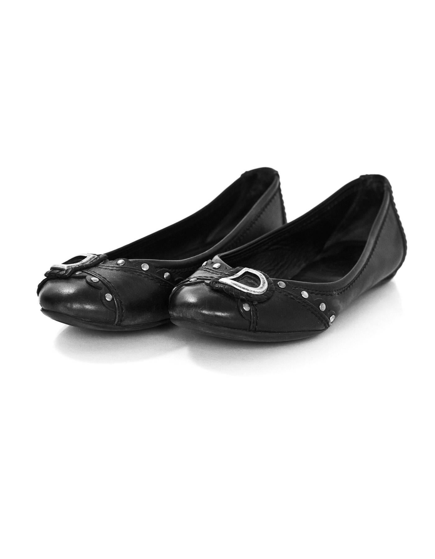 Christian Dior Black Leather D Flats Sz 35.5

Color: Black
Materials: Leather, metal
Closure/Opening: Slide on
Sole Stamp: Dior
Overall Condition: Very good pre-owned condition with the exception of moderate wear and soiling at insoles and