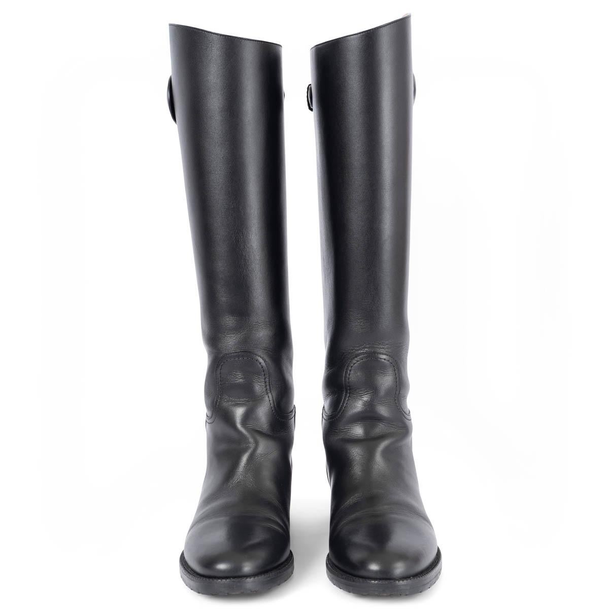 100% authentic Christian Dior Diorable knee high riding boots in black calfskin features a strap adorned with a gold-finish 'CD' buckle. Have been worn and are in excellent condition. Come with dust bag. 

Measurements
Model	KCH365VEAS900
Imprinted