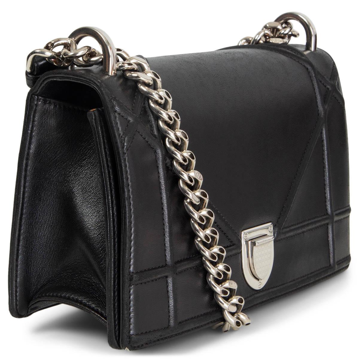 100% authentic Christian Dior Small Diorama shoulder flap bag in black smooth leather. Silver-tone metal chain and leather shoulder-strap. Lined in pale pink grosgrain fabric with an open pocket against the front and a zipper pocket against the
