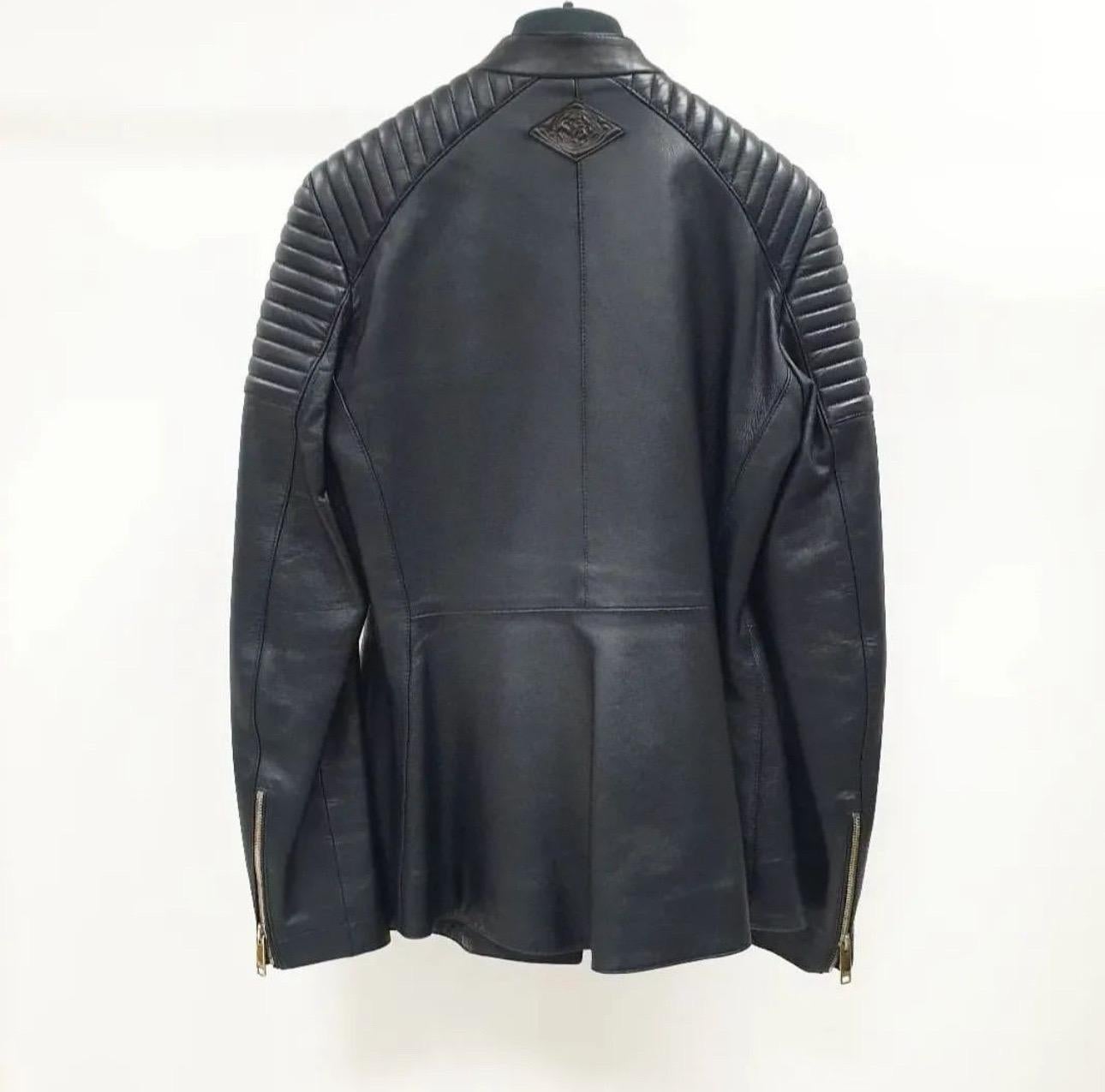  Christian Dior Biker jacket in black lamb leather (100%). Lined in black silk (100%). 
Opens with two buttons on the collar and an asymmetrical zipper on the front. 
Features logo details in the front and upper back, silver zippers on the front