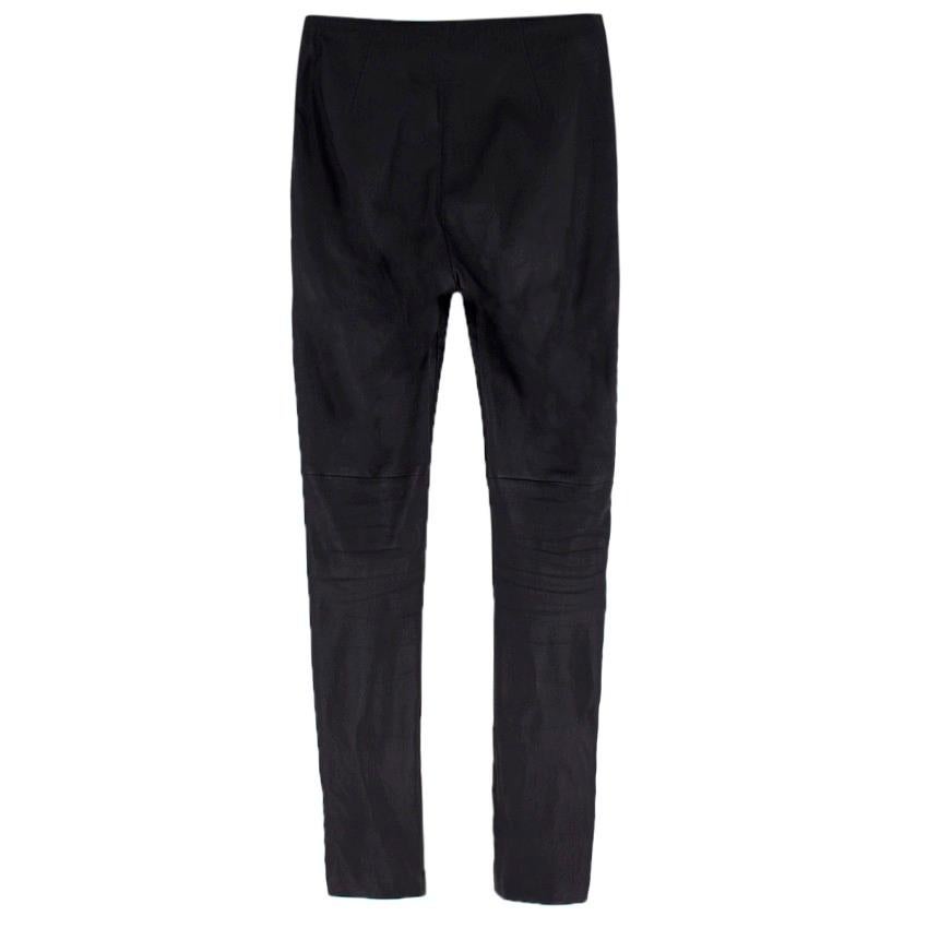 Christian Dior black leather skinny-fit trousers

- Black, stretch leather
- Mid rise skinny leg
- Zip-fastening hems 
- Concealed side-zip fastening 

Please note, these items are pre-owned and may show some signs of storage, even when unworn and