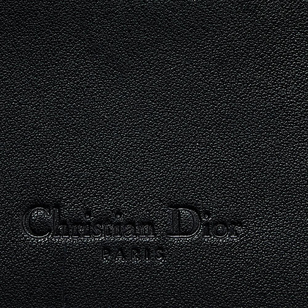 This Christian Dior wallet is an immaculate balance of sophistication and rational utility. It has been designed using prime quality materials and elevated by a sleek finish. The vintage Gaucho Saddle wallet is equipped with ample space for your
