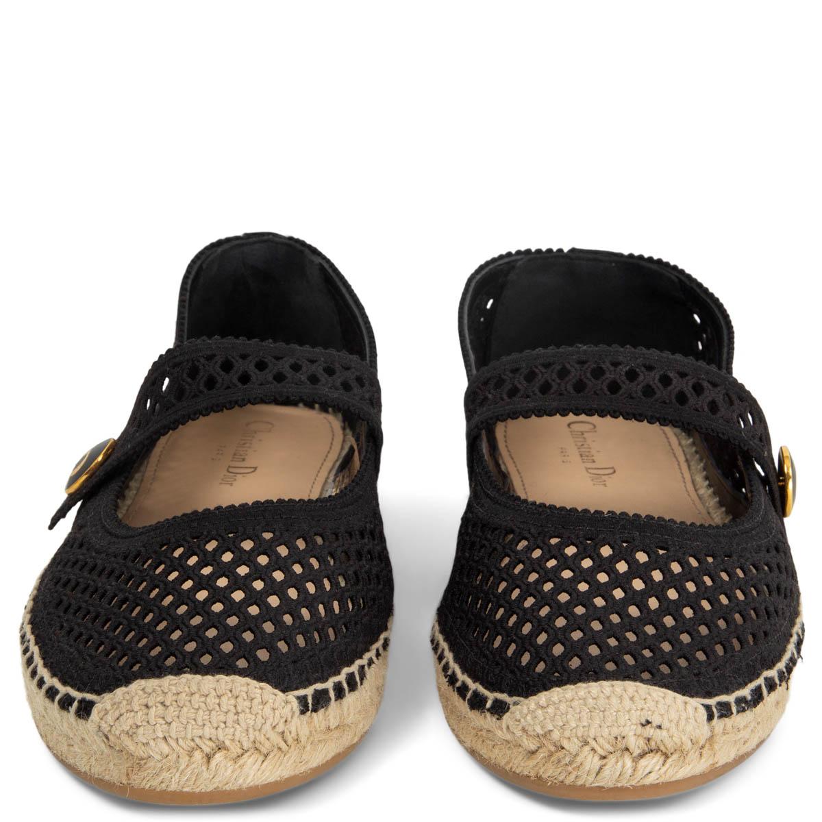 100% authentic Christian Dior Caro espadrilles in black mesh-like embroidered cotton, it’s embellished with a strap that features a non-removable button with the CD logo. The soles are handmade and crafted in traditional way with rope and feature a