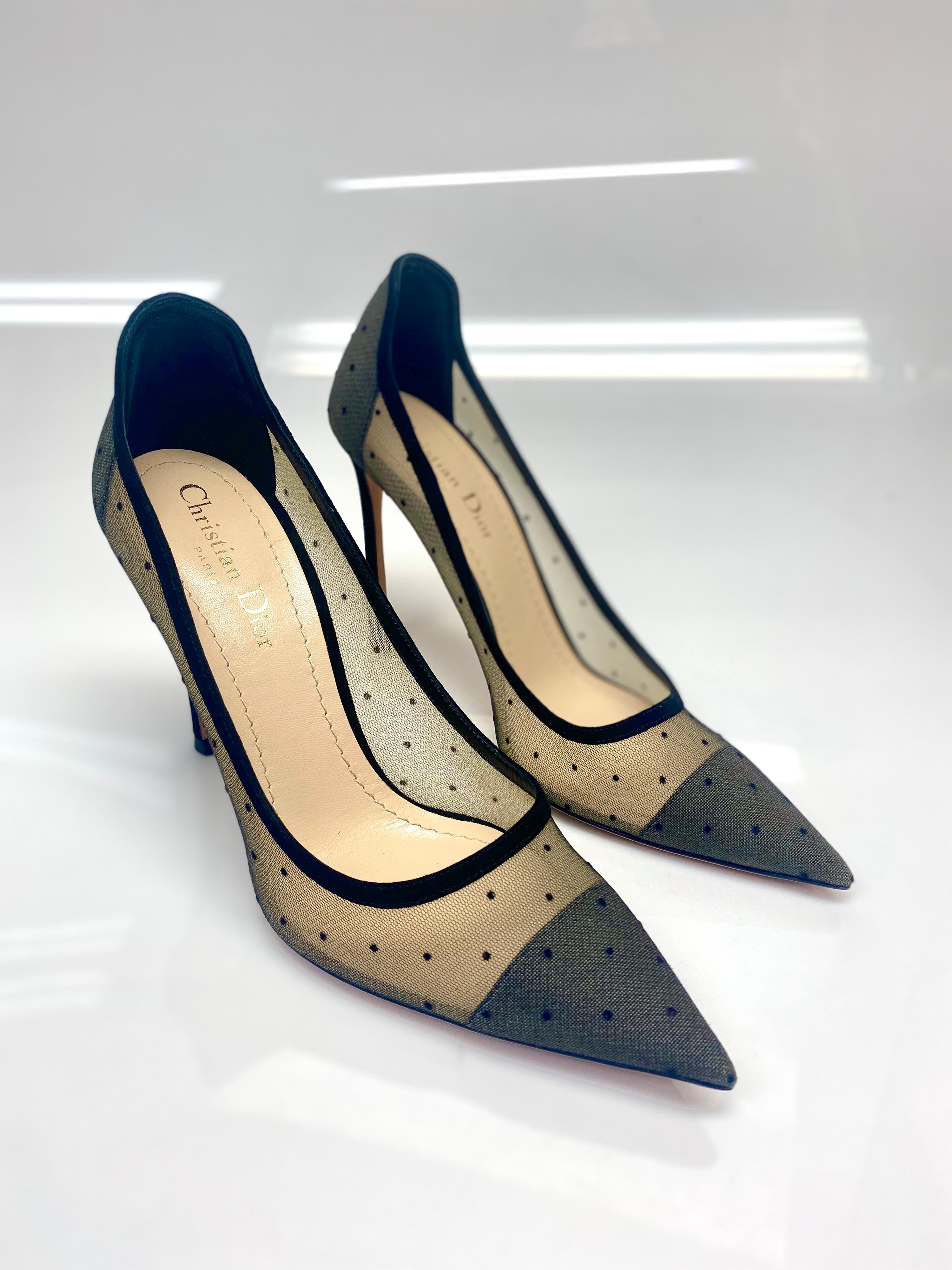 Christian Dior Black Mesh Polka Dot Suede Heels Size 39. These stunning pumps from Christian Dior are truly a standout. Featuring mesh detailing with black polka dots and black suede lining. The heel has a pointed toe for a sophisticated look. Size