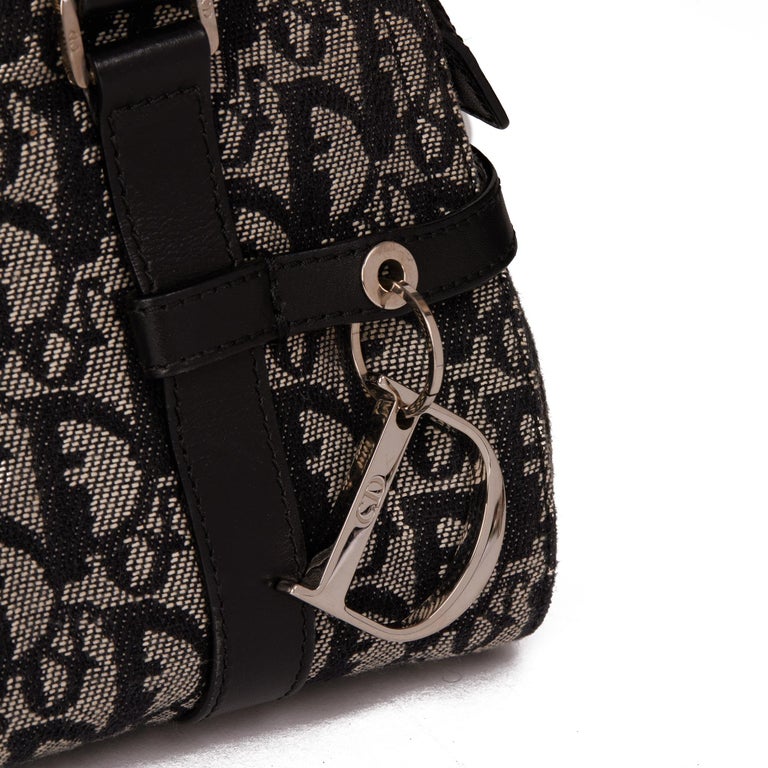 A black monogram canvas speedy bag by Christian Dior. - Bukowskis