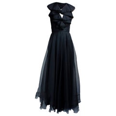 Schwarzes Christian Dior-Abendkleid aus Seide mit offenem Rücken. ca. 1970er Jahre 