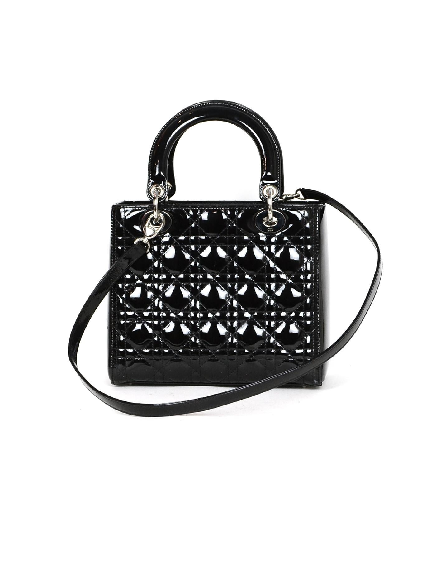 Christian Dior Black Patent Leather Cannage Medium Lady Dior Bag.  Includes optional shoulder strap and silvertone DIOR signature charms.

Made In: Italy
Color: Black
Hardware: Silvertone
Materials: Patent leather, metal
Lining: Fine black