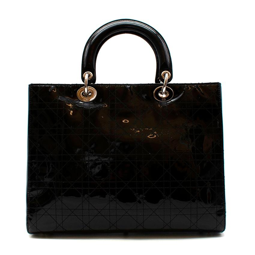 Christian Dior Black Patent Leather Large Lady Dior Bag

The Lady Dior bag epitomizes Dior's vision of elegance and beauty. Refined and sophisticated, the timeless yet relevant style is crafted in black patent calfskin with Cannage stitching,