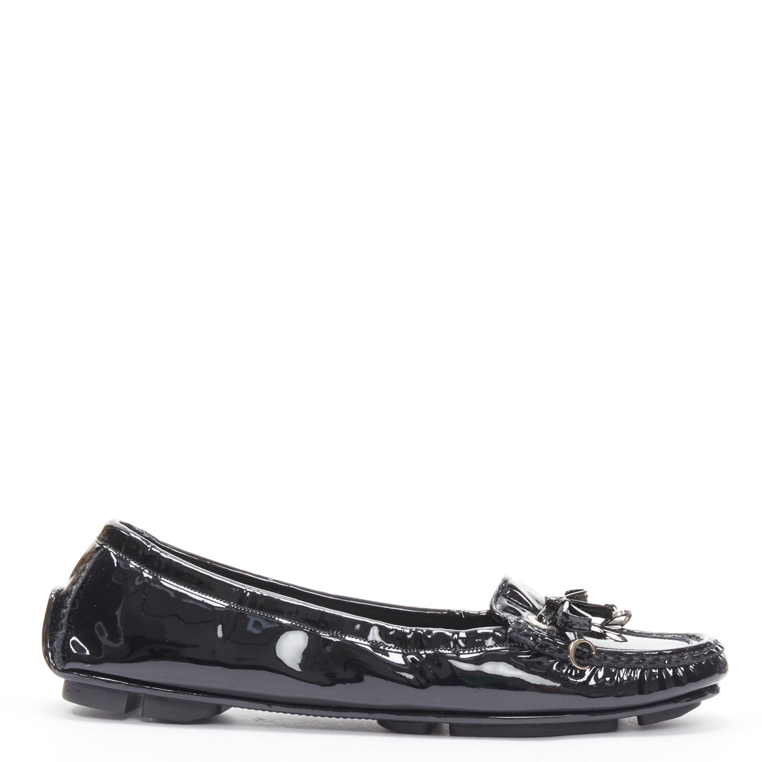 CHRISTIAN DIOR black patent silver CD charm bow flat loafer EU37 
Reference: CELG/A00227 
Brand: Christian Dior 
Material: Patent Leather 
Color: Black 
Pattern: Solid 
Made in: Italy 

CONDITION: 
Condition: Excellent, this item was pre-owned and