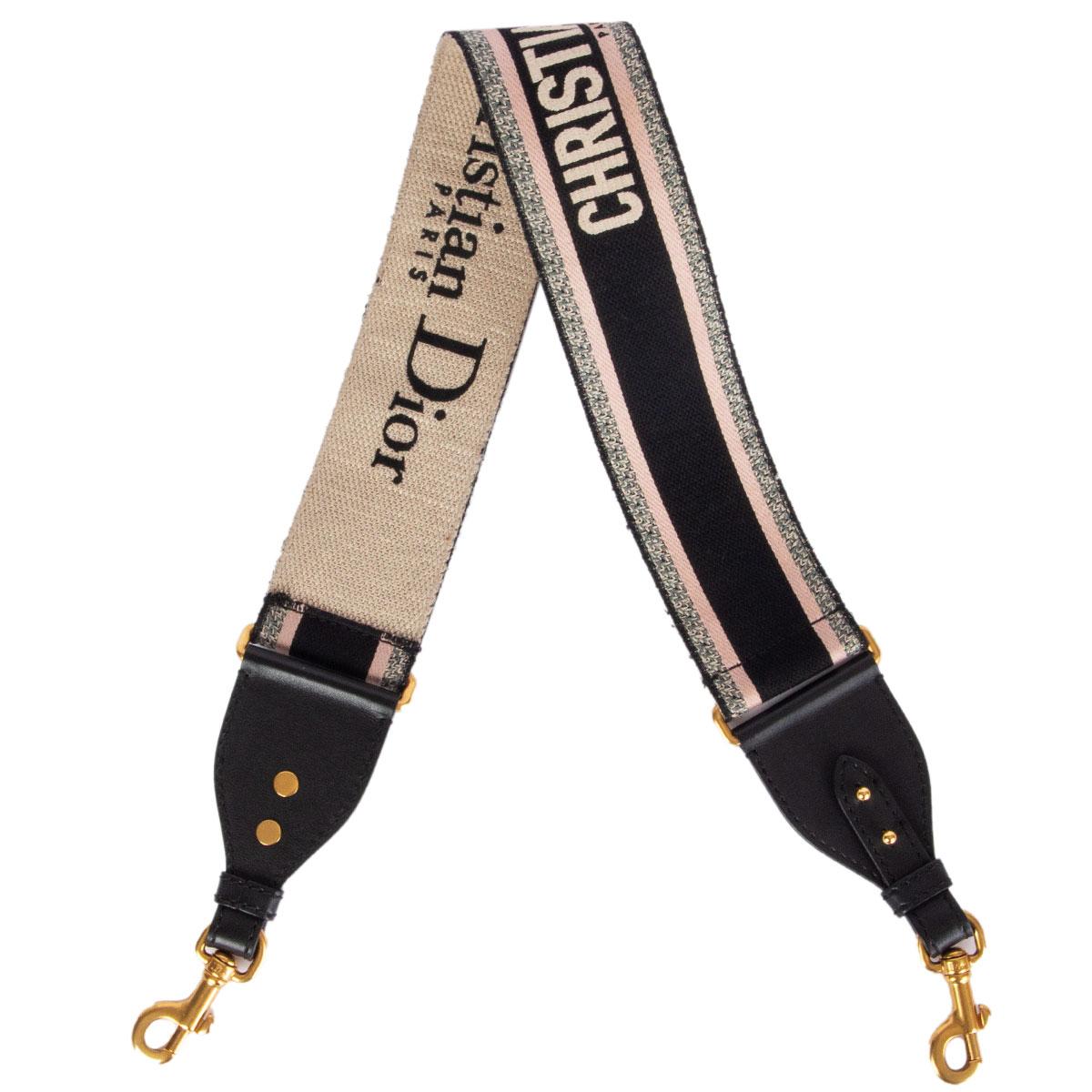 100% authentic Christian Dior embroidered shoulder-strap in pale rose, light grey, black and sand canvas is characterized by a bold ‘Christian Dior’ signature. Crafted using a fully embroidered technique, the strap is a way to customize and add a