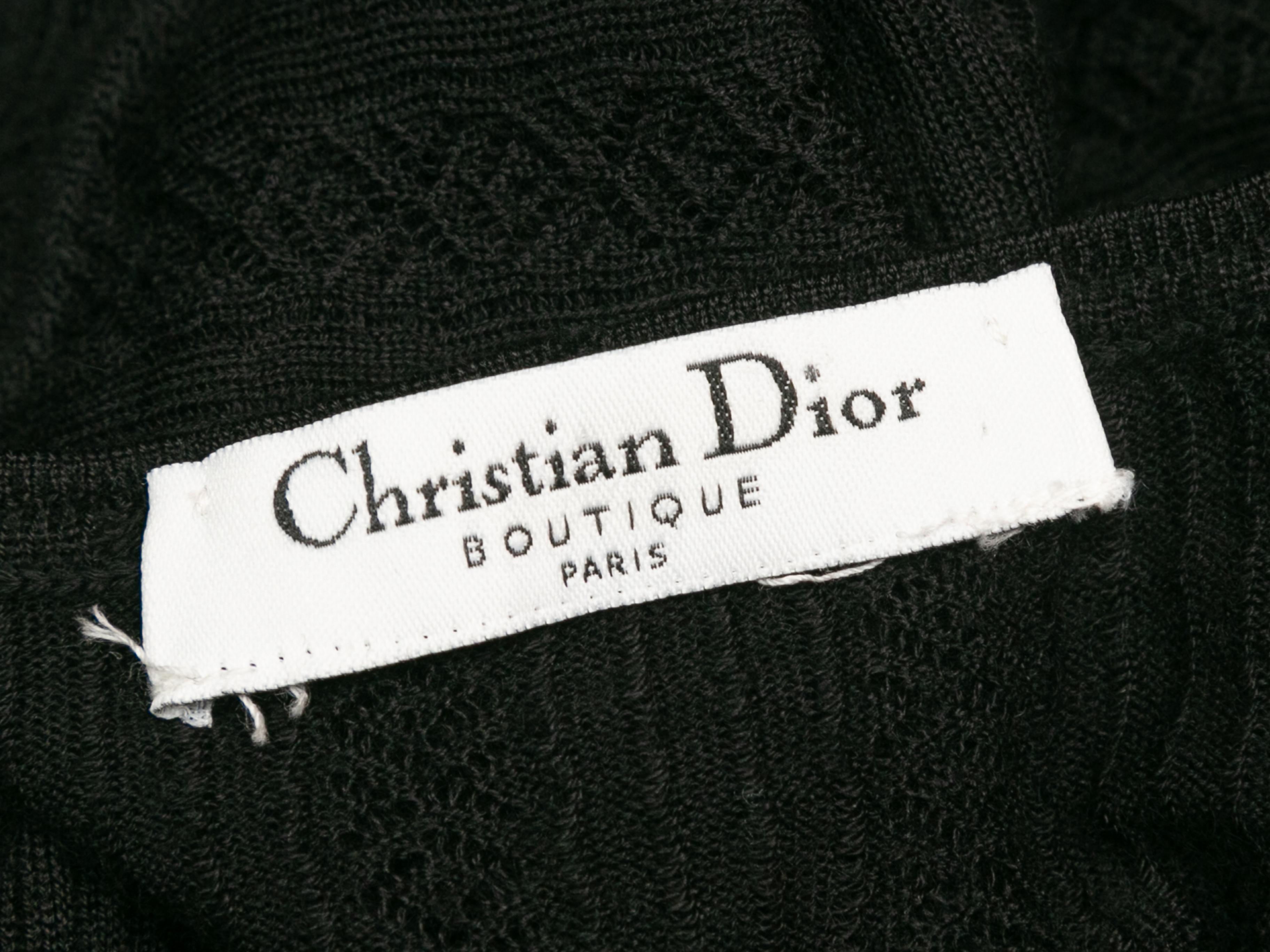 Product details: Black sheer knit long sleeve top by Christian Dior. Plunging V-neckline. 40