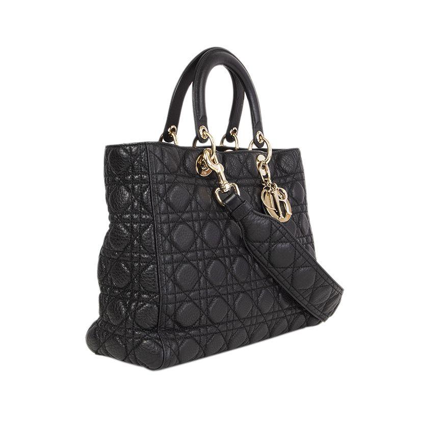 Christian Dior 'Lady Dior Large' bag in black grained 'Cannage' soft lambskin featuring a 'Cannage' detachable shoulder strap (got purchased extra for $ 795.-). Opens with a flap on top and is lined in black suede with one zip pocket against the