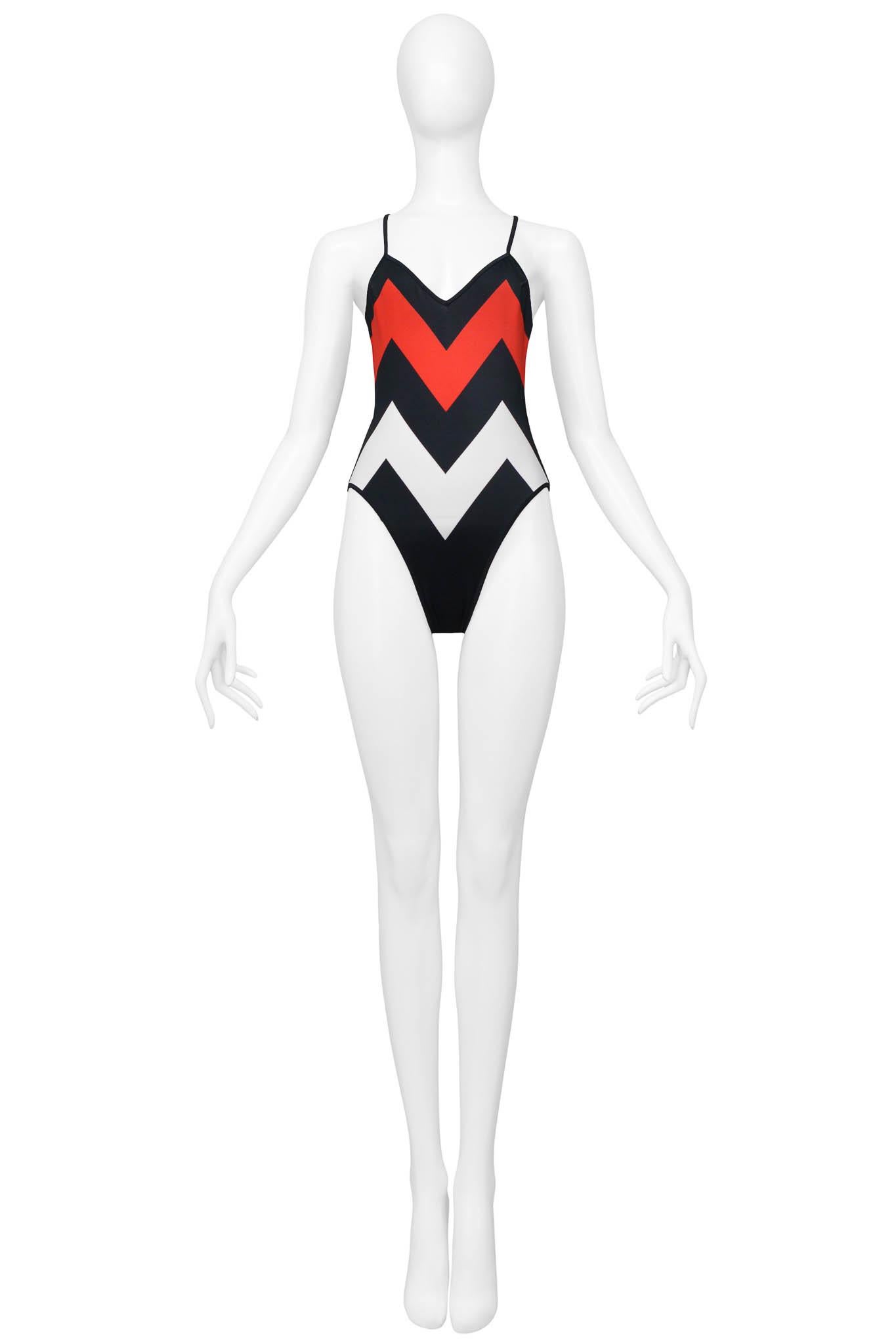Resurrection is excited to offer a vintage Christian Dior red, white, and black swimsuit featuring, cross straps, a zigzag pattern, an open back, and a high hip leg cut.  

Christian Dior
Size 38
Polyester & Elastane 
Excellent Vintage