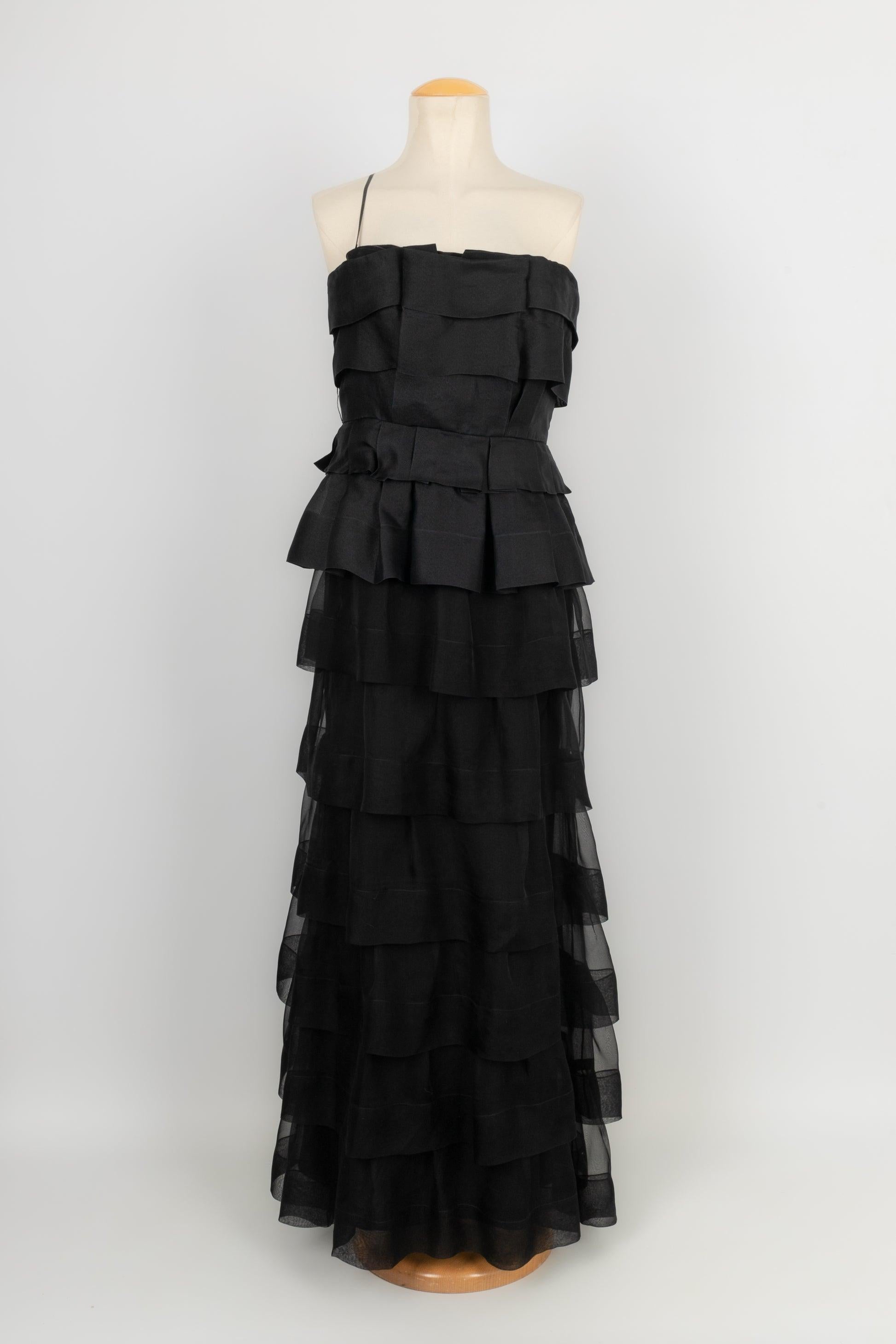 Dior - (Made in France) Black silk flounced bustier dress. Indicated size 42FR. 2009 Collection under the artistic direction of John Galliano.

Additional information:
Condition: Very good condition
Dimensions: Chest: 53cm
Waist: 38 cm
Length: 140