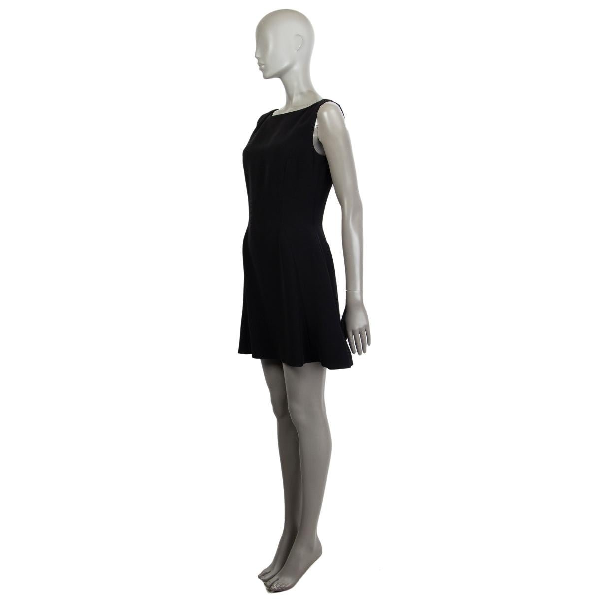Christian Dior sleeveless mini dress in black silk (100%) with a round neck. Closes on the back with a concealed zipper. Lined in silk (100%). Has been worn and is in excellent condition.  

Tag Size 38
Size S
Shoulder Width 36cm (14in)
Bust From