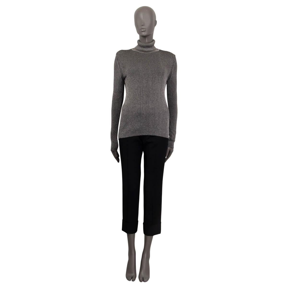 100% authentic Christian Dior sweater in silver and black viscose (84%) and polyester (16%). Features long sleeves and a turtle neck. Unlined. Has been worn and is in excellent condition. 

Measurements
Tag Size	L
Size	L
Shoulder Width	35cm