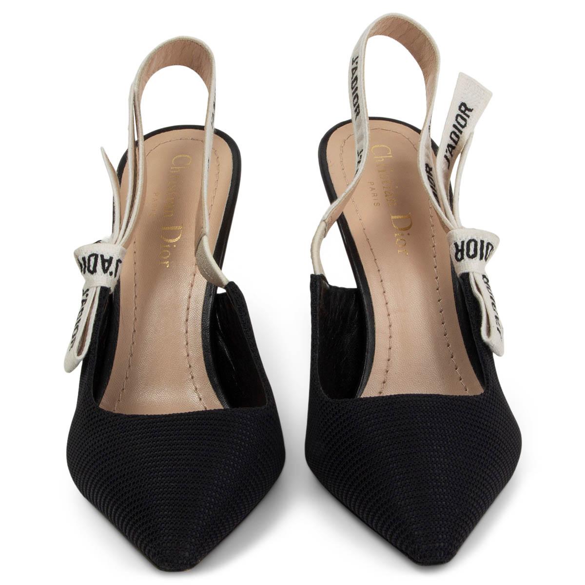 100% authentic Christian Dior J'Adior slingback pumps in black technical fabric with a calfskin heel. Embellished with a two-tone embroidered 'J'ADIOR' ribbon with a flat bow. Have been worn and are in excellent condition. Come with dust bag.